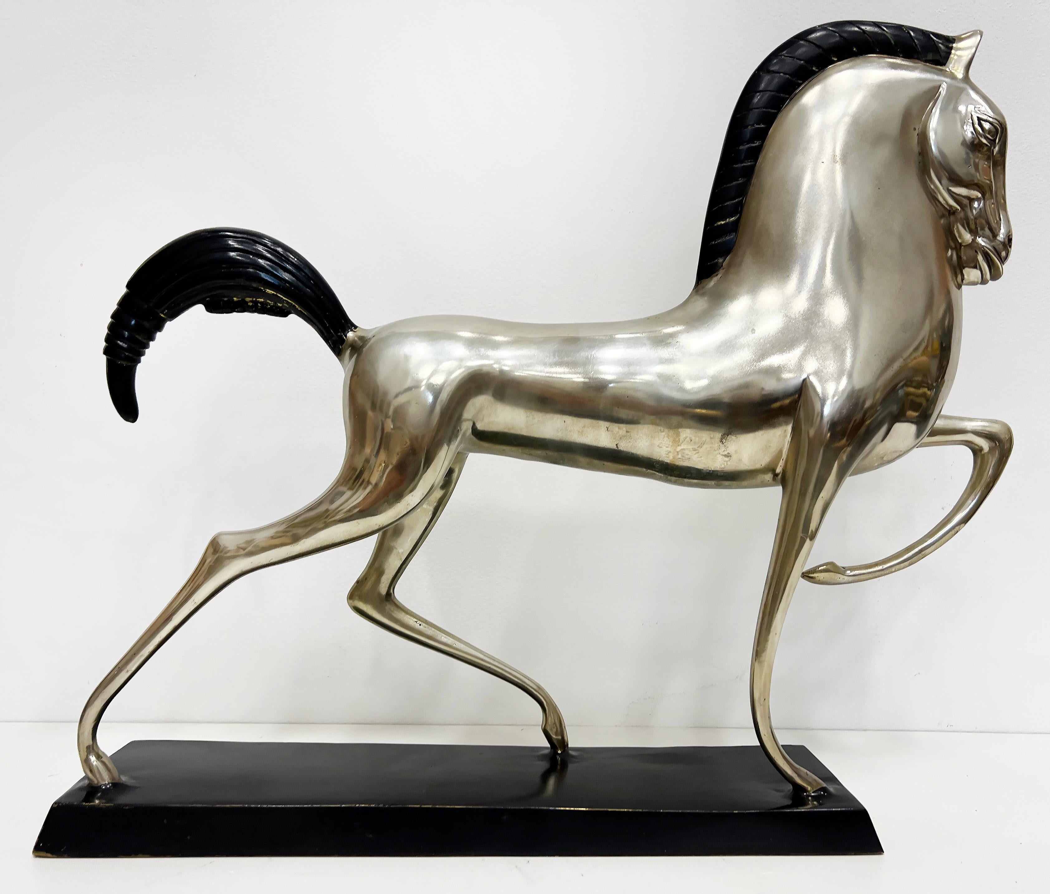 Deco Style Silvered Bronze Etruscan Horse Sculpture, Boris Lovet-Lorski Style

Offred for sale is a stylized silvered bronze Etruscan horse sculpture created in the style of Boris Lovet-Lorski. The dramatic horse is silver plated with a black mane