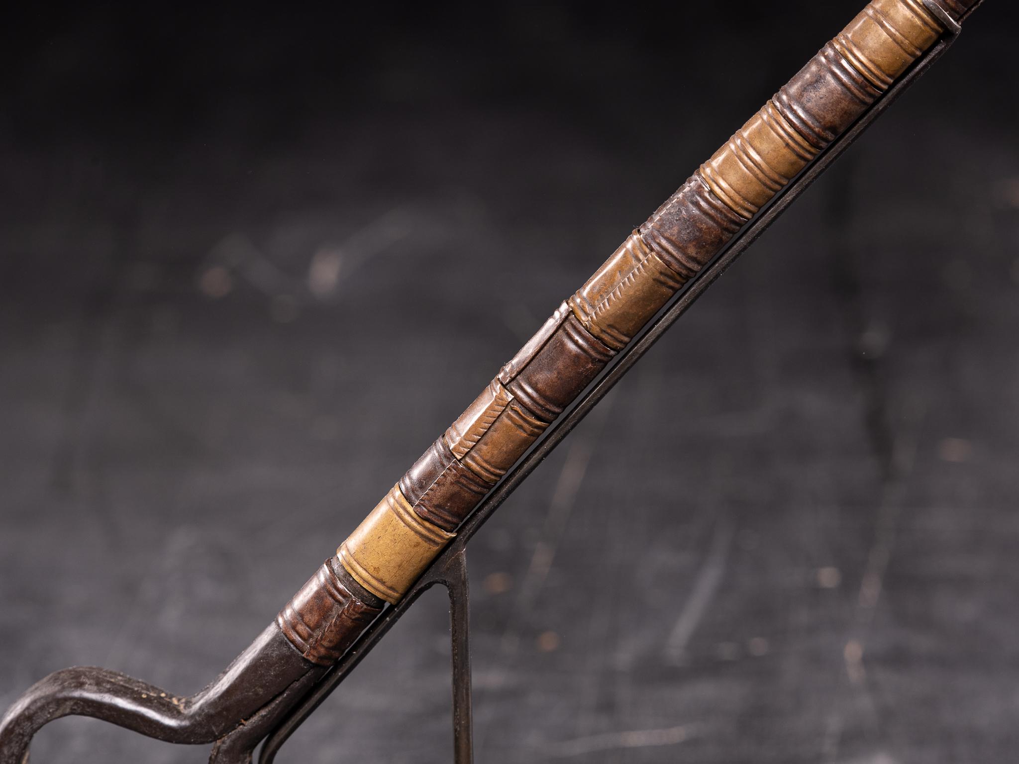 This small decorated Whip is in excellent state for its age.The wooden base is decorated with metal and copper wiring and the end is made out of animal skin.
The topwas probably designed in the form of a key ,in order to be to be worn on a belt.