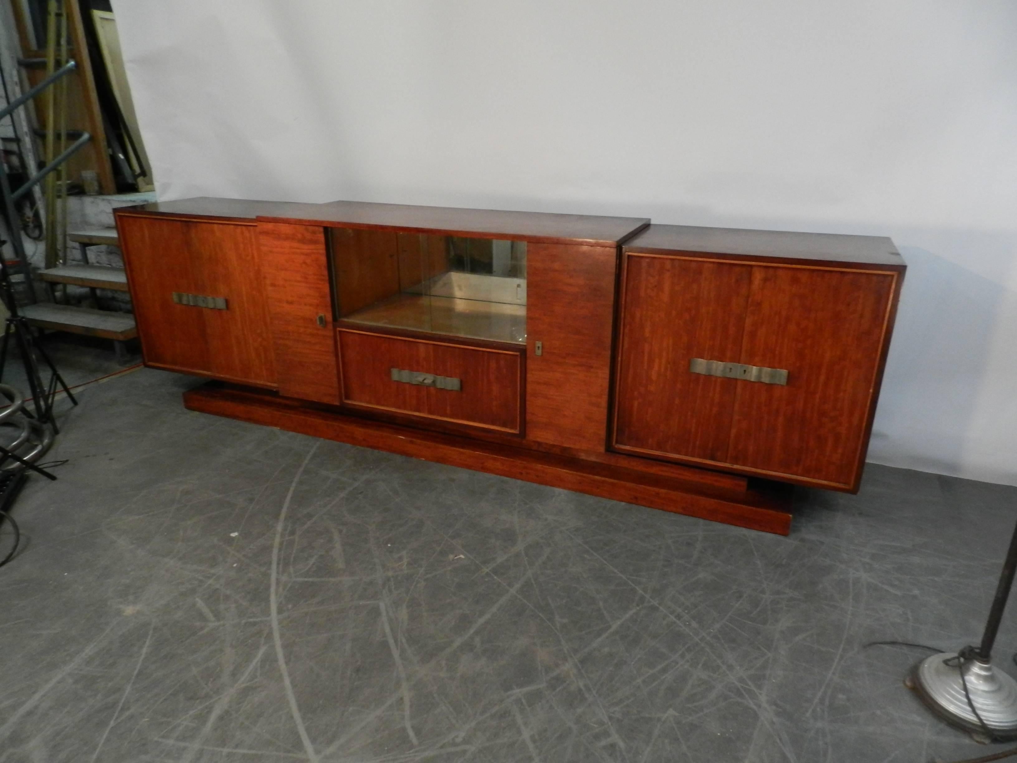 Decoene Freres, large Art Deco sideboard in MOVINGUI MOIRE ,
circa 1930.