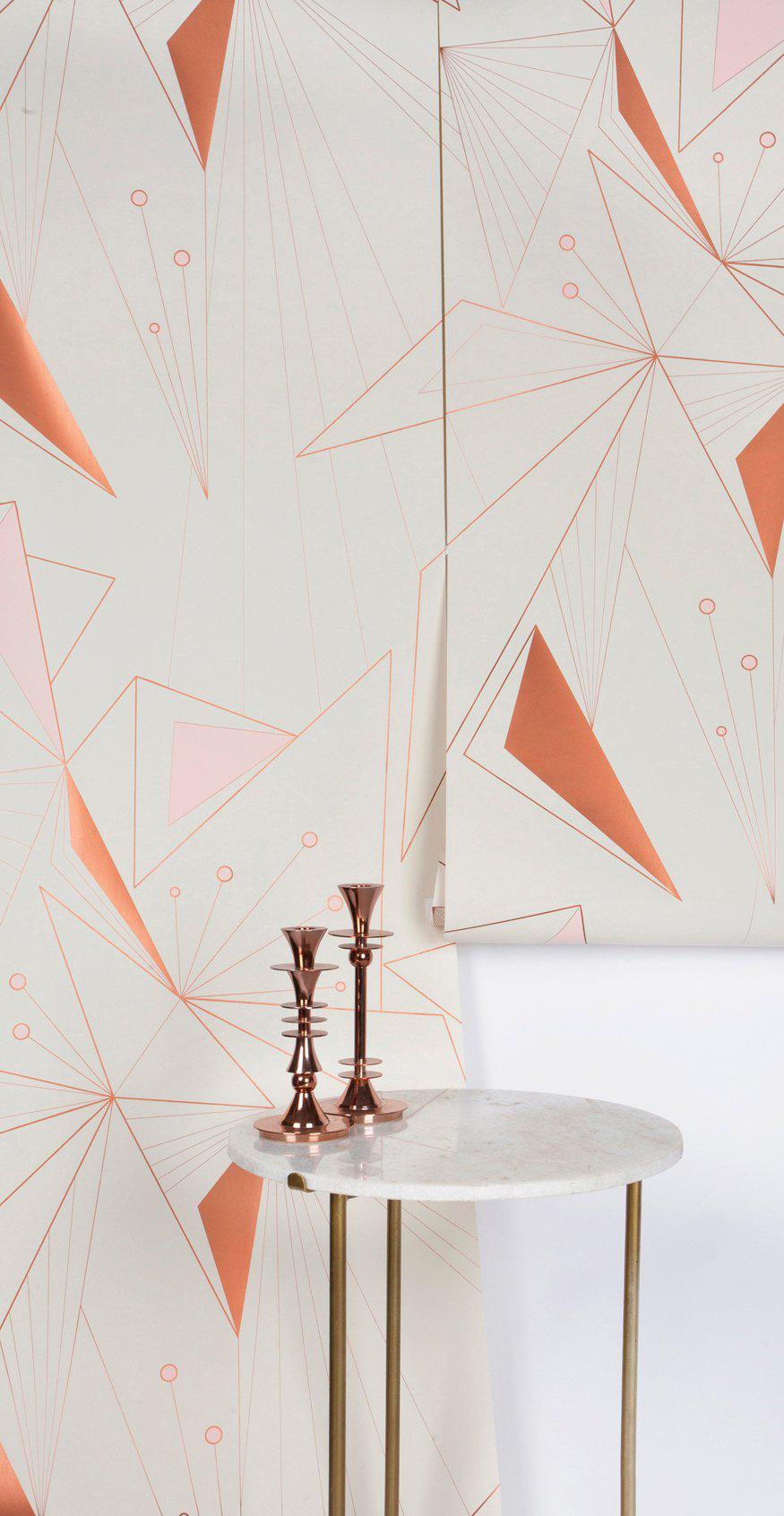 This modern and geometric wallpaper adds graphic warmth and texture to your walls in a soft color palette of metallic copper, peachy pink and off-white. It works well with Mid-Century Modern, Hollywood Regency, Art Deco and contemporary decor.

We