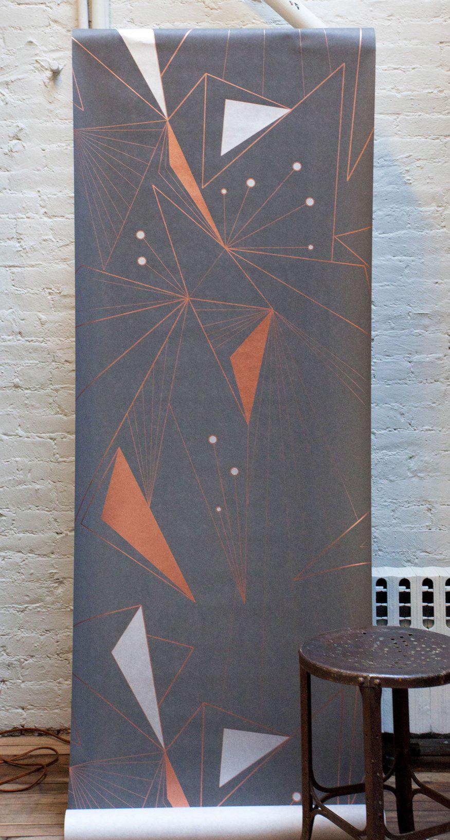 This modern, and geometric wallpaper adds graphic warmth and texture to your walls in a metallic palette of bronze/gold, copper and silver on a matte charcoal gray background. It works well with Mid-Century Modern, Hollywood Regency, Art Deco and