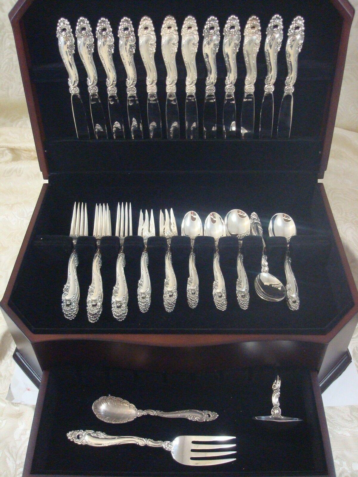 Dinner size Decor by Gorham sterling silver Flatware set - 63 Pieces. This pattern is heavy and features rococo swirls, shells, & small flowers. This set includes:

12 dinner knives, 9 5/8