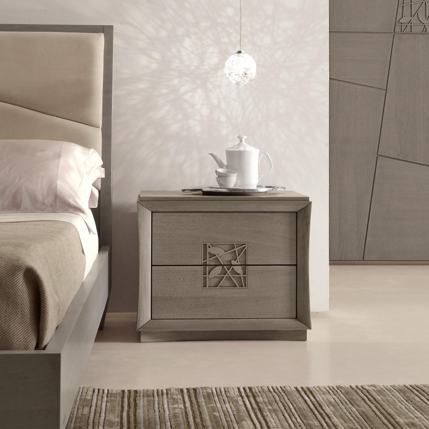 Designed to complement the Decor Bed, the Decor Nightstand features a leaf design in its two front drawers, lending it an original and sophisticated touch. Handleless for a smooth look, the drawers open with a push mechanism. The nightstand is