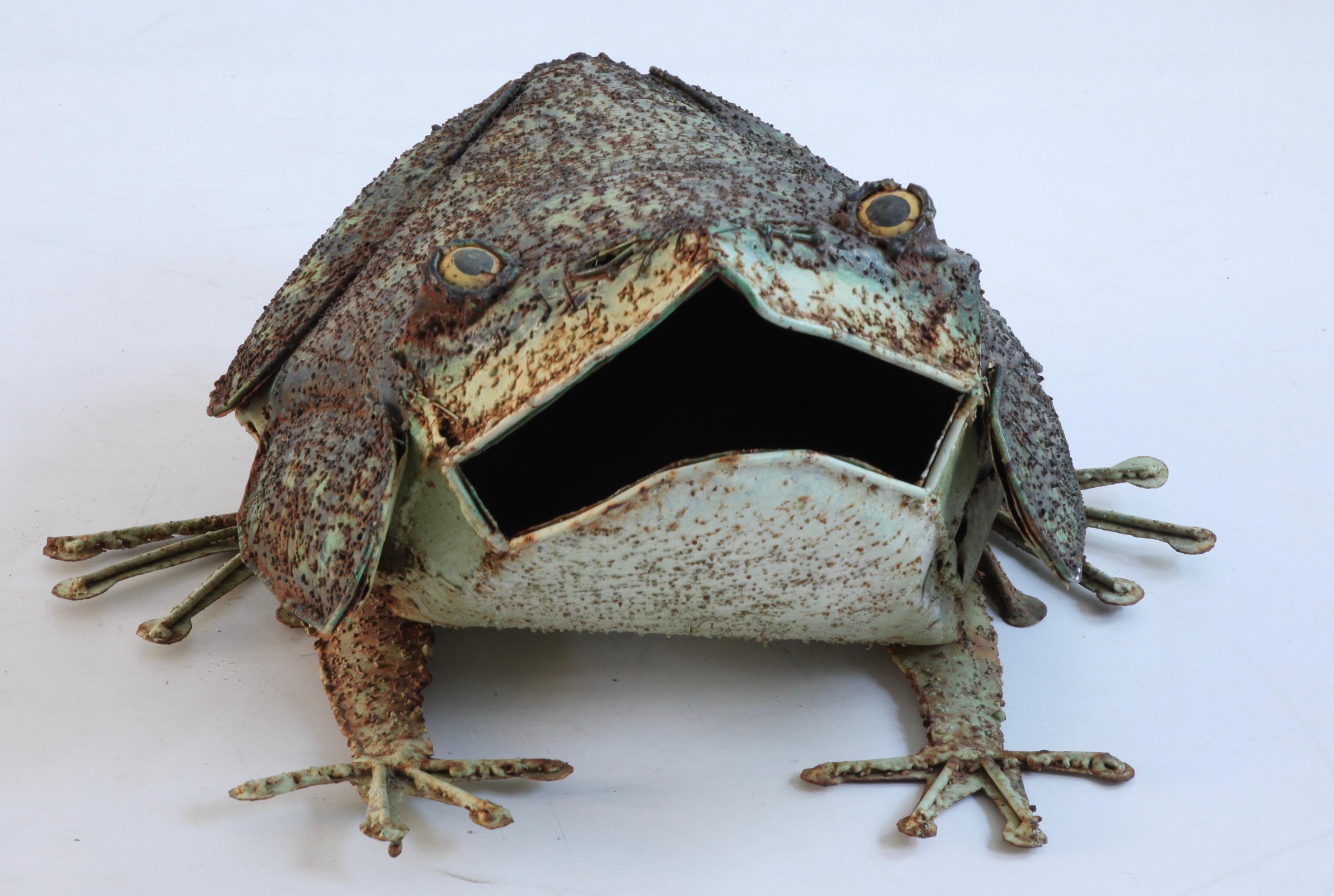 A 1950’s hand crafted decorative  frog sculpture formed  in metal originating from France. It’s open mouth section can be used for optional planting. Made with character. Suitable for the garden.