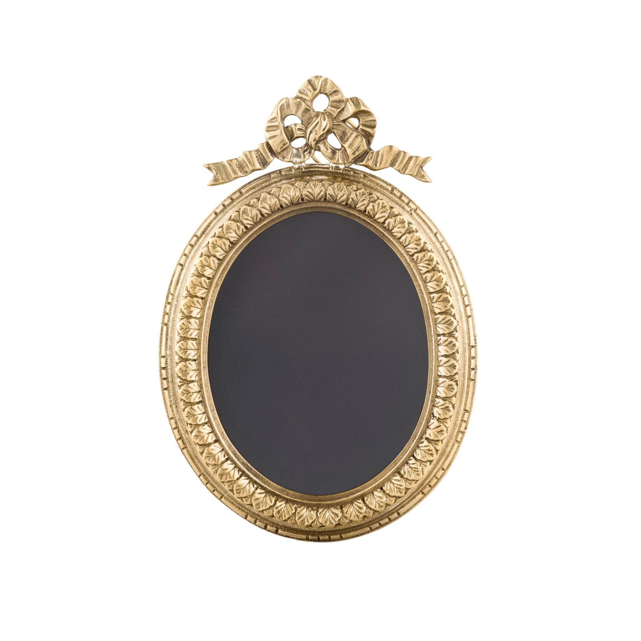 Add a touch of vintage charm to your home with our beautiful decorated brass frame with ribbon. Crafted from high-quality brass, this unique and elegant frame features a lovely ribbon design that complements any decor style. Perfect for displaying