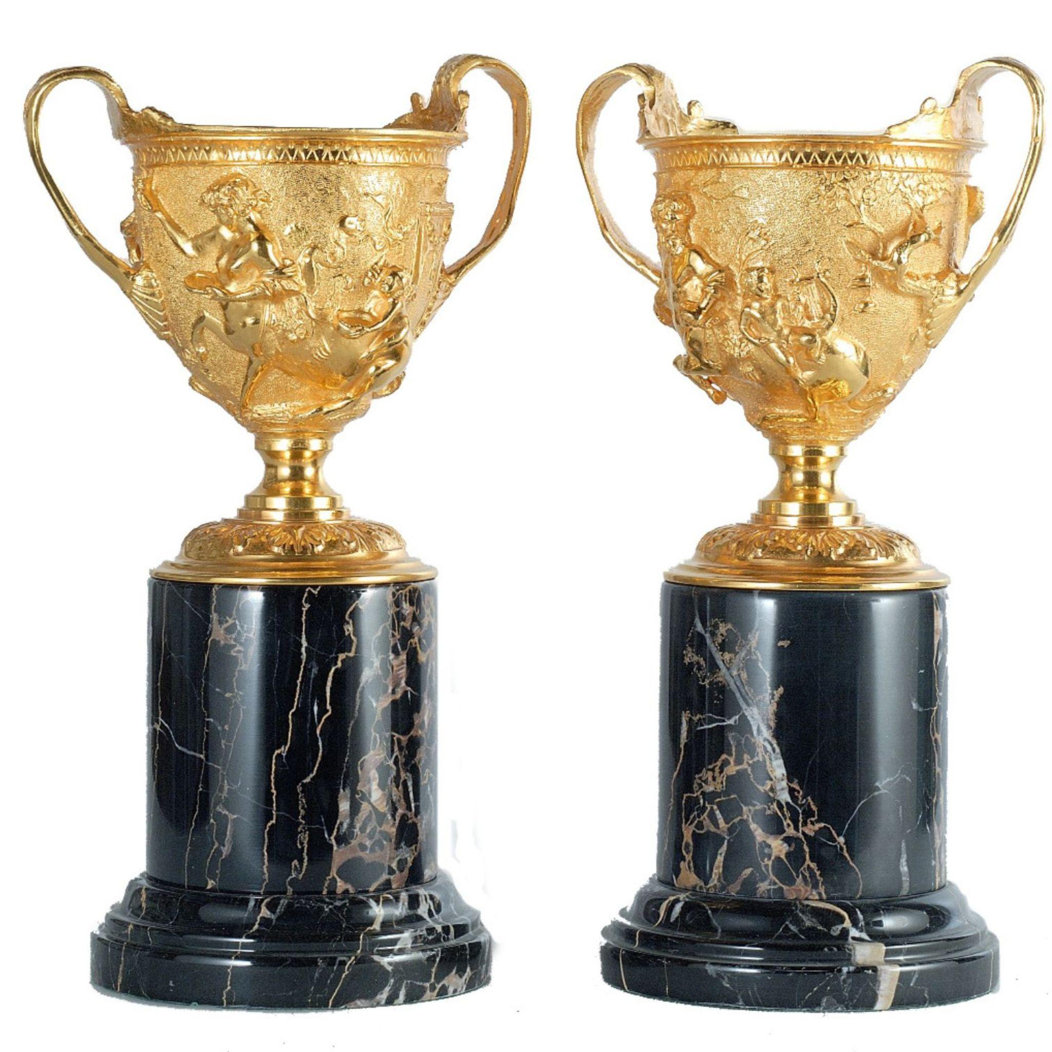Italian Hercules Satin brass cup with black marble base For Sale