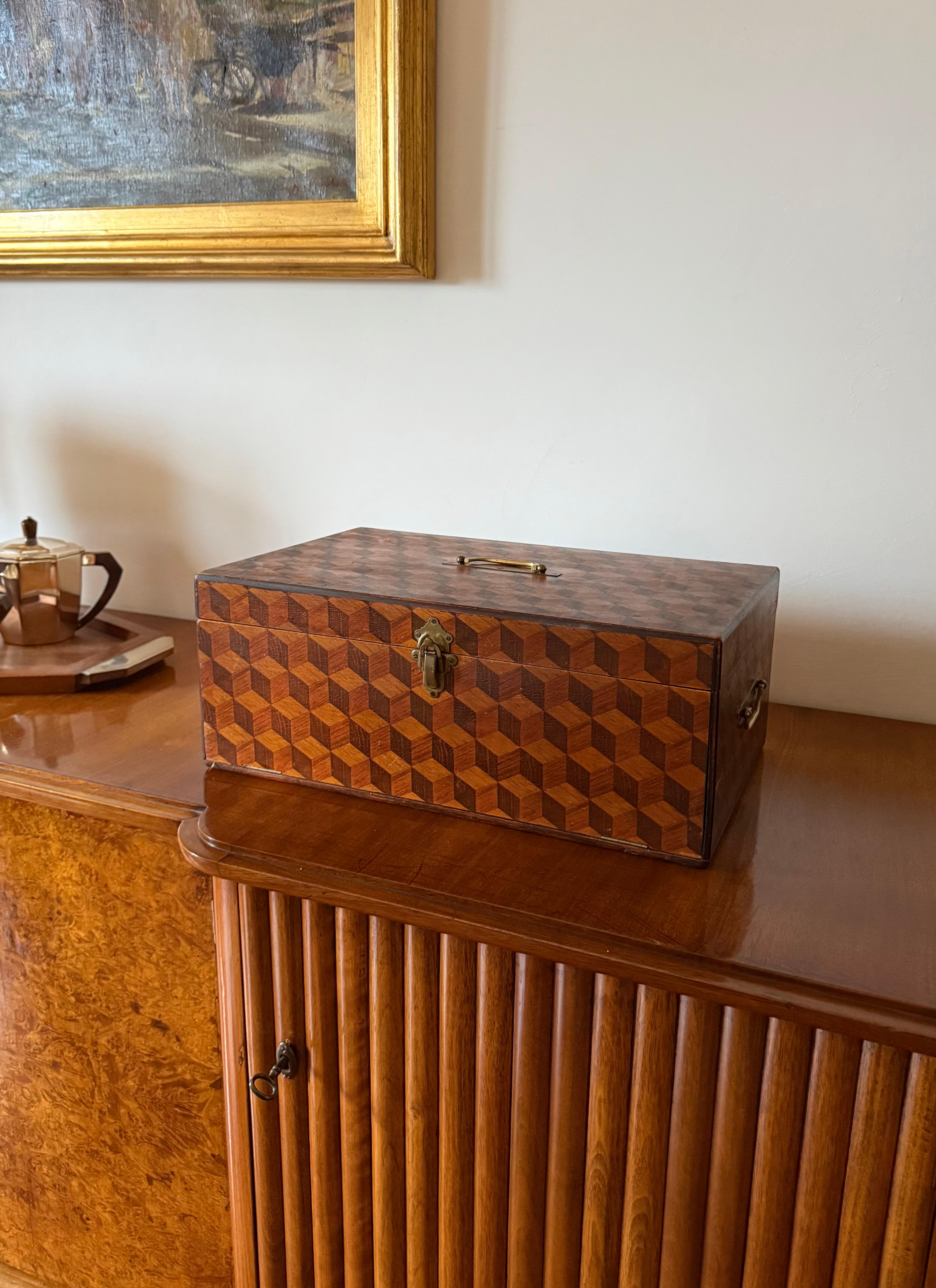 Decorated wooden drawers Box

United Kingdom 1900s

perspective cubes decoration

H 18 cm  

45 × 27 cm

Conditions: excellent consistent with age and use.