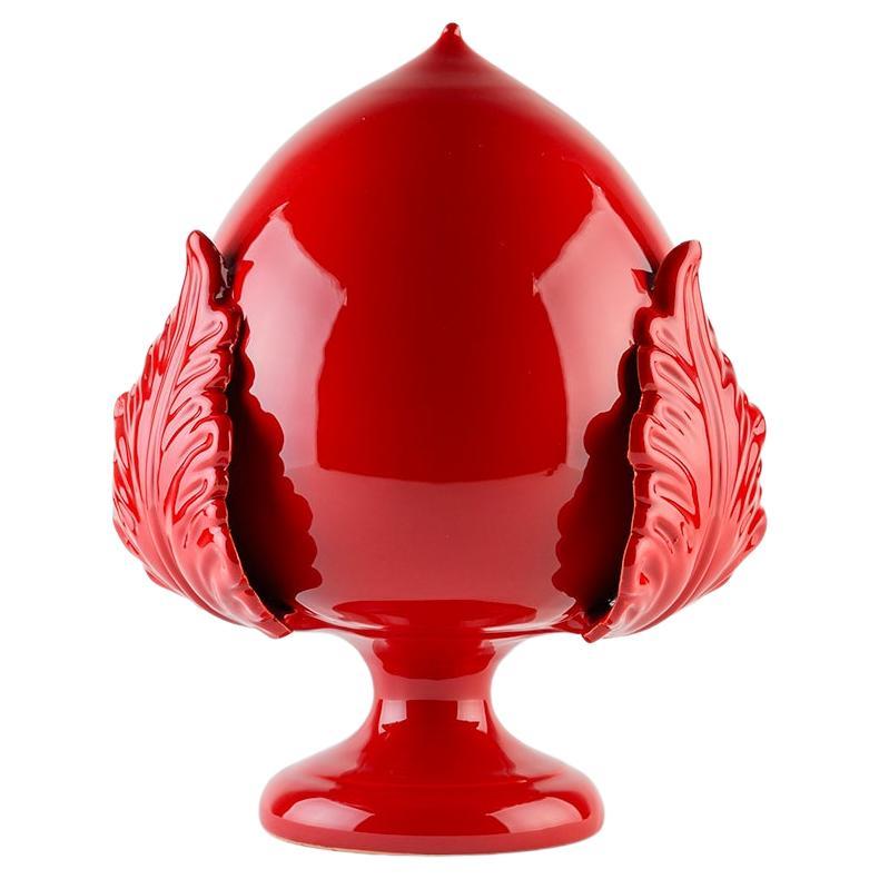 The Apulian Pumo is a symbol of prosperity, fertility and luck, represented by an acanthus bud. Traditionally, it was placed in front of houses to protect them from harm and to attract wealth and happiness to the family.

The Bottega is today