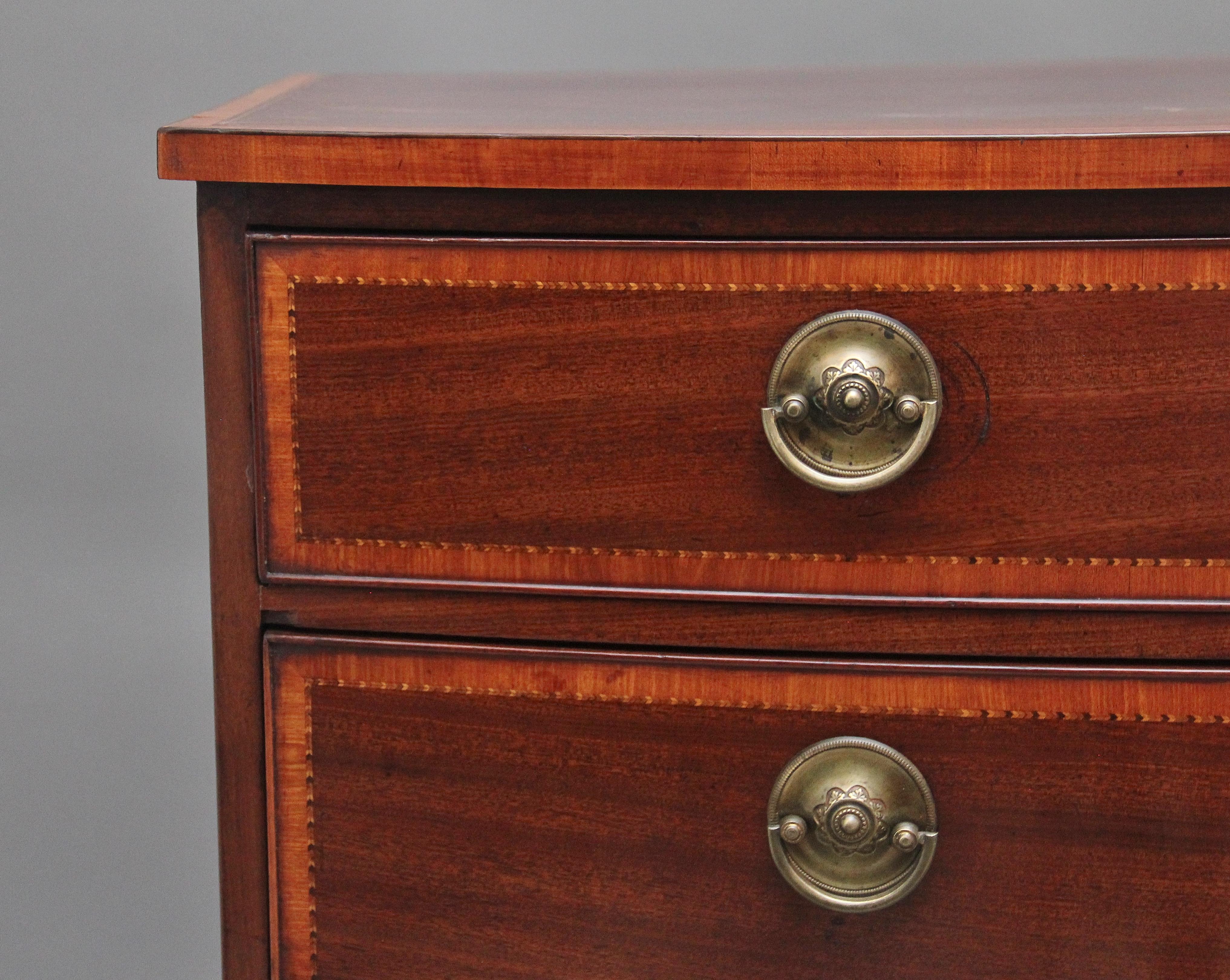 A highly decorative 18th Century mahogany bowfront chest of drawers, having a nice figured and crossbanded top above four graduated oak lined drawers with brass oval plate handles, the drawer fronts crossbanded and having decorative chequered inlay
