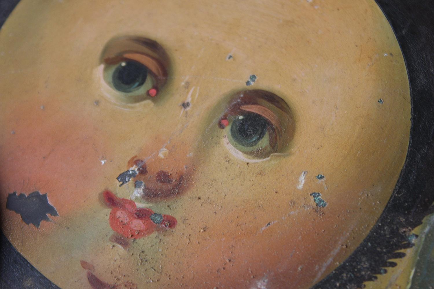 The eight day face with arched top and rolling moon phase saw wheel, having two hemispheres and the whole being hand painted with roman numerals, the corners with floral sprays, the moon phase with a galleon ship and a cottage by a lake, the top