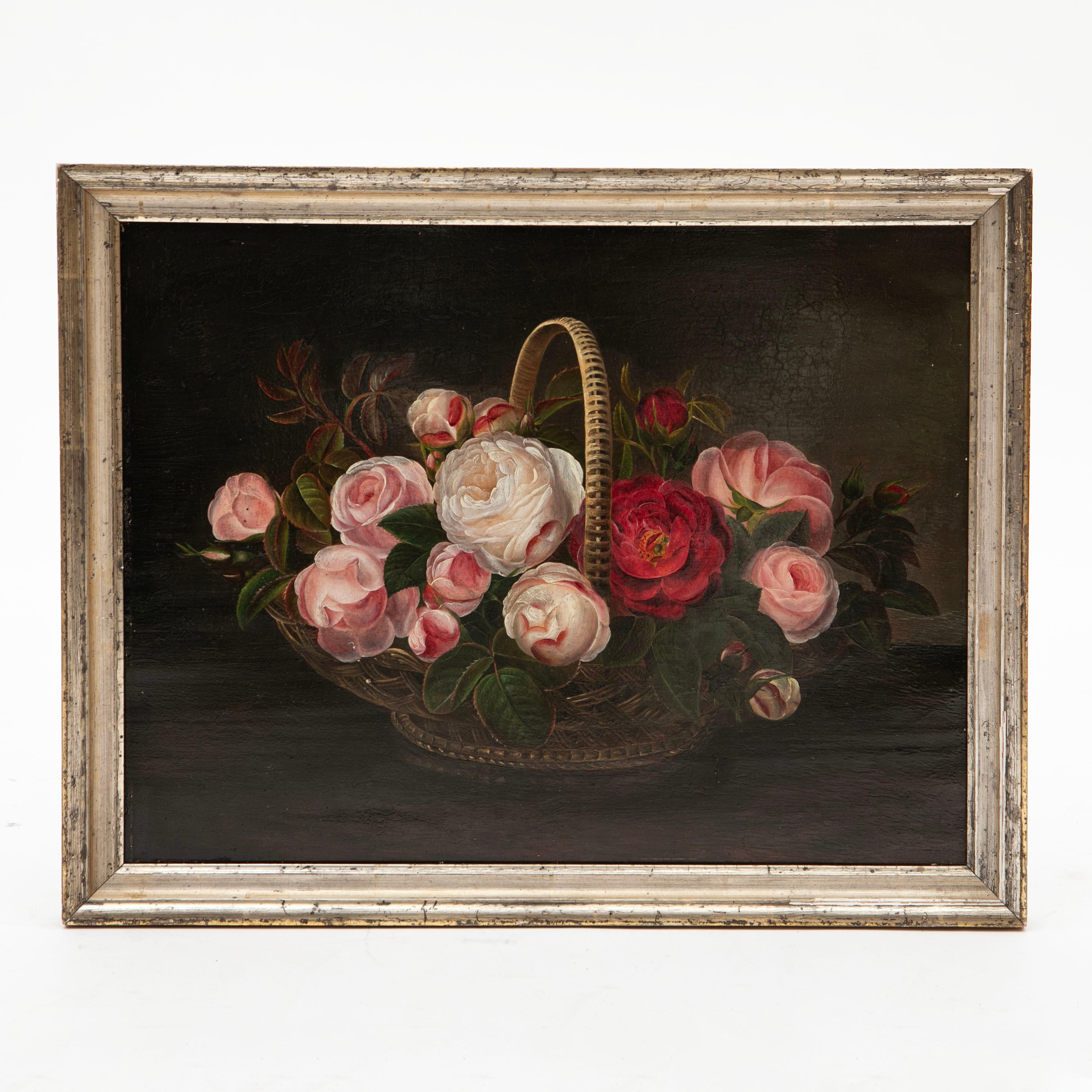I.L. Jensen, School, 1840-1850
A beautiful and decorative oil painting depicting an arrangement of pink, white, and red roses in a basket. Painted on mahogany and unsigned, it is presented in an elegant 19th-century silver frame. This work is rich