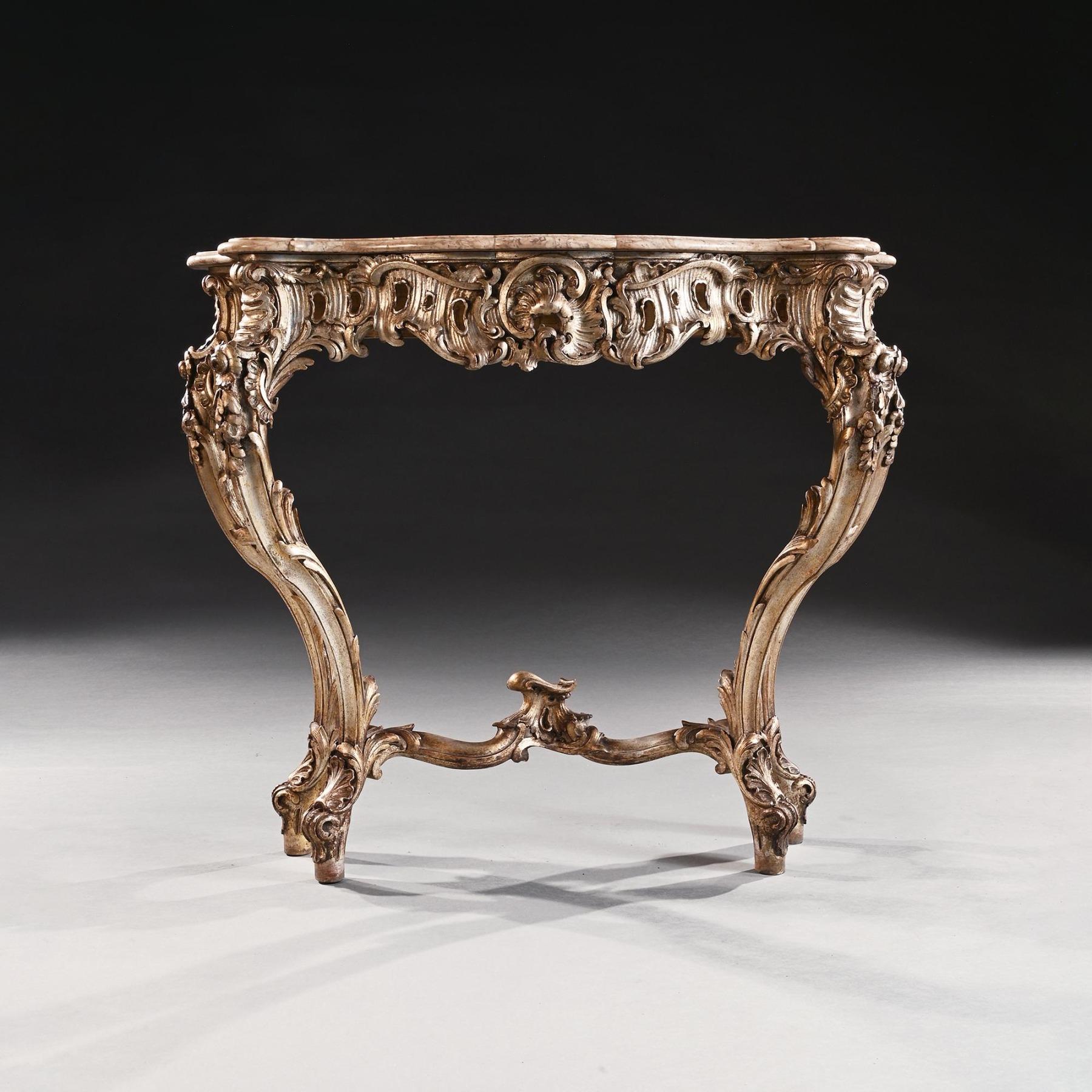 Decorative 19th Century Silver Gilt Italian Console Table with Shaped Marble Top

Italian circa 1880

Of sumptuous rococo form, this fine console table centres on an cartouche, surrounded by scroll carving. The combination of foliate detailing and
