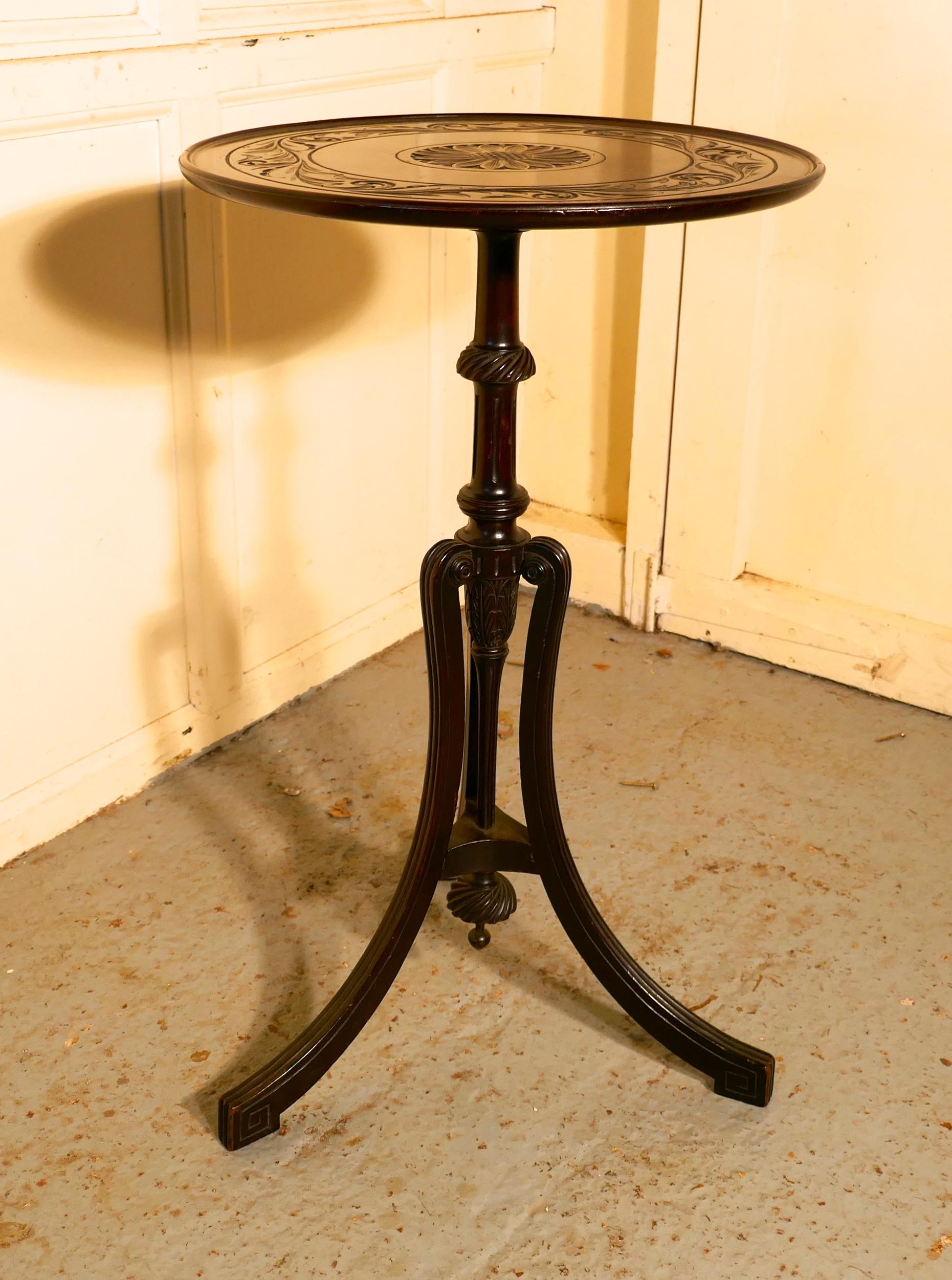 Decorative 2 tone Art Nouveau Wine Table by Bulstrode of Cambridge

This lovely table stands on a very unusual three footed base it has an exquisitely turned centre column with the reeded splayed legs scrolling out from quite a high point
The round