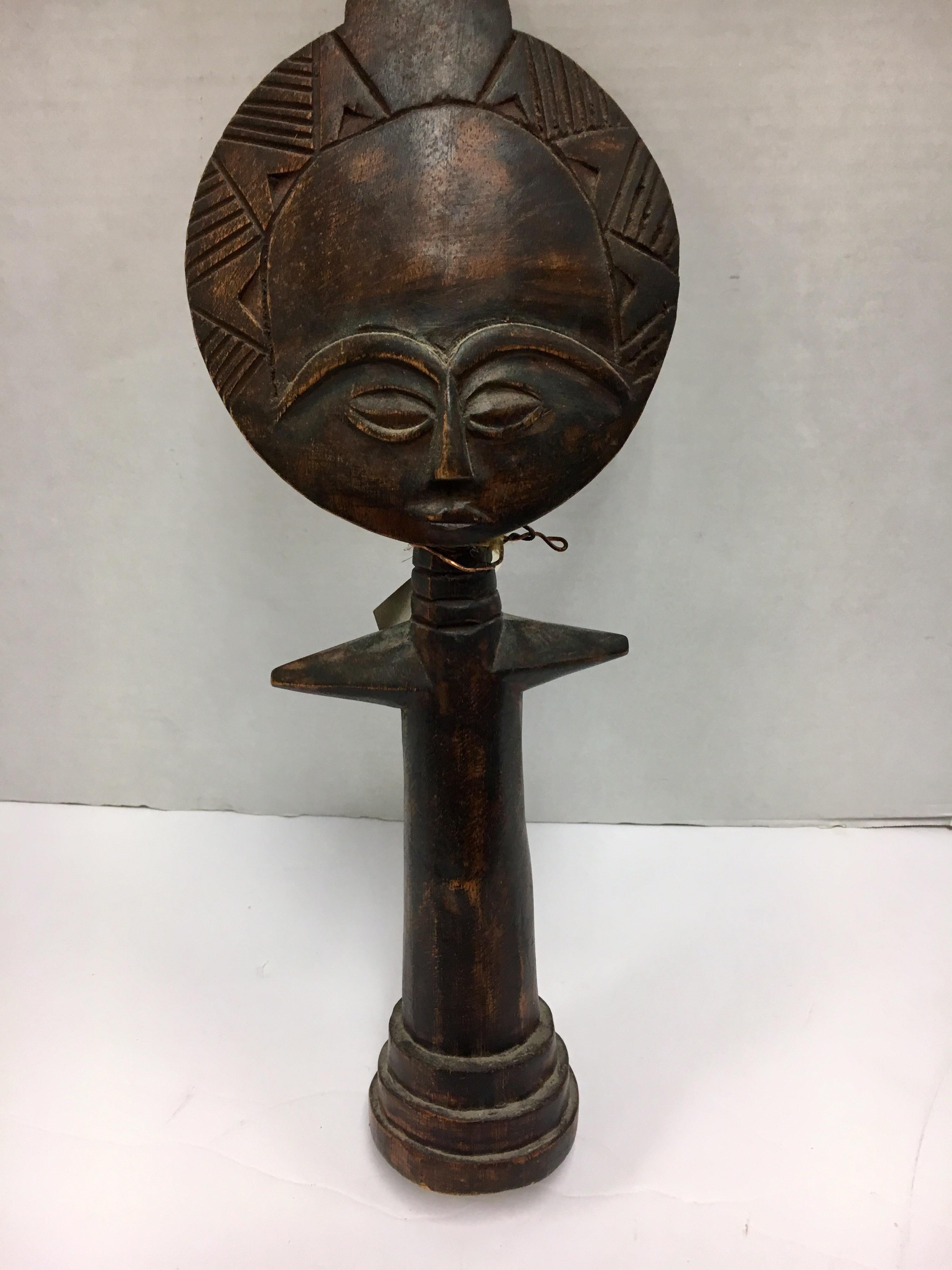 Coveted decorative African hand carved wood mask with graphic elements, circa 1960s
This is a decorative item from the 1960s, it was made for export, it is not an antique tribal mask.
It was made by a master carver from a single piece of wood and