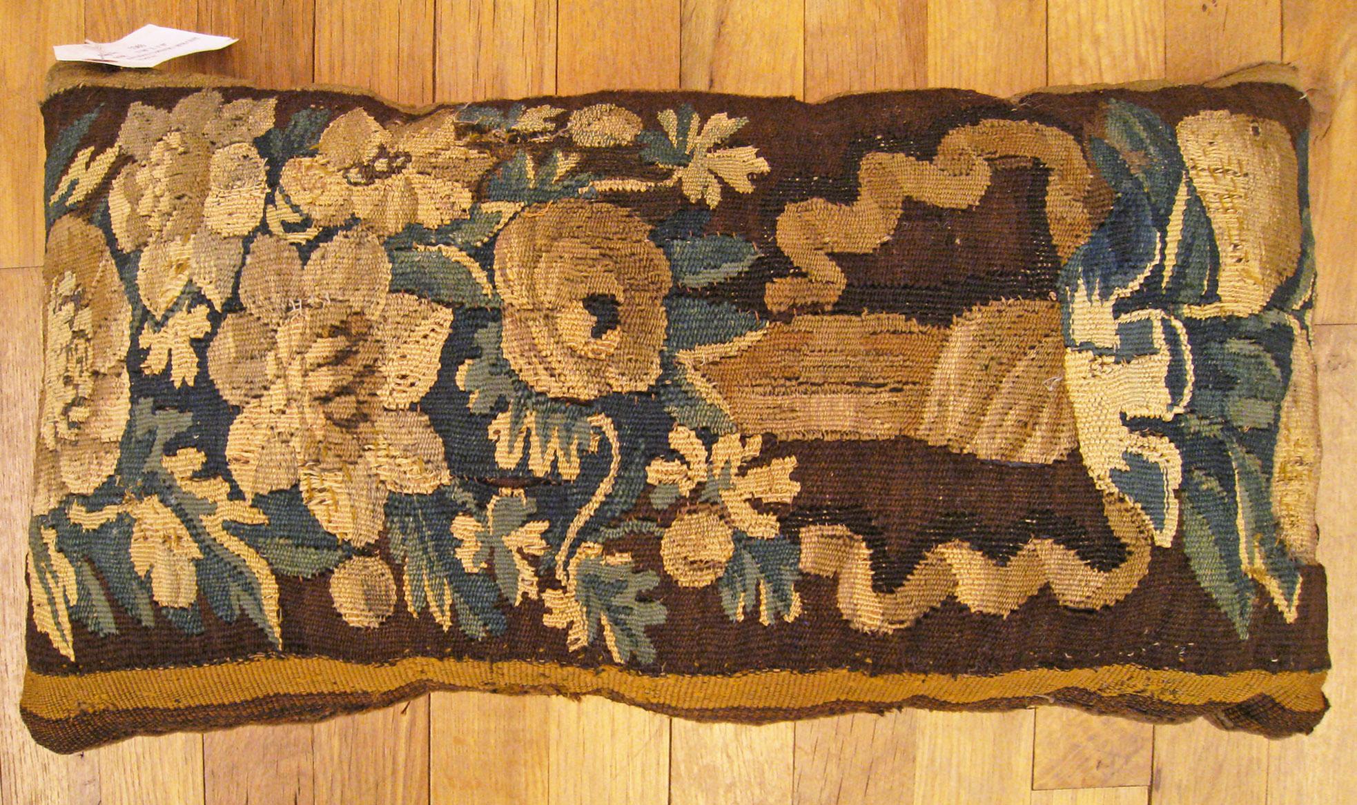 Antique 18th Century Tapestry Pillow; size 1'0” x 1'10”.

An antique decorative pillow with floral elements allover a brown central field, size 1'0” x 1'10”. This lovely decorative pillow features an antique fabric of a 18th century tapestry on