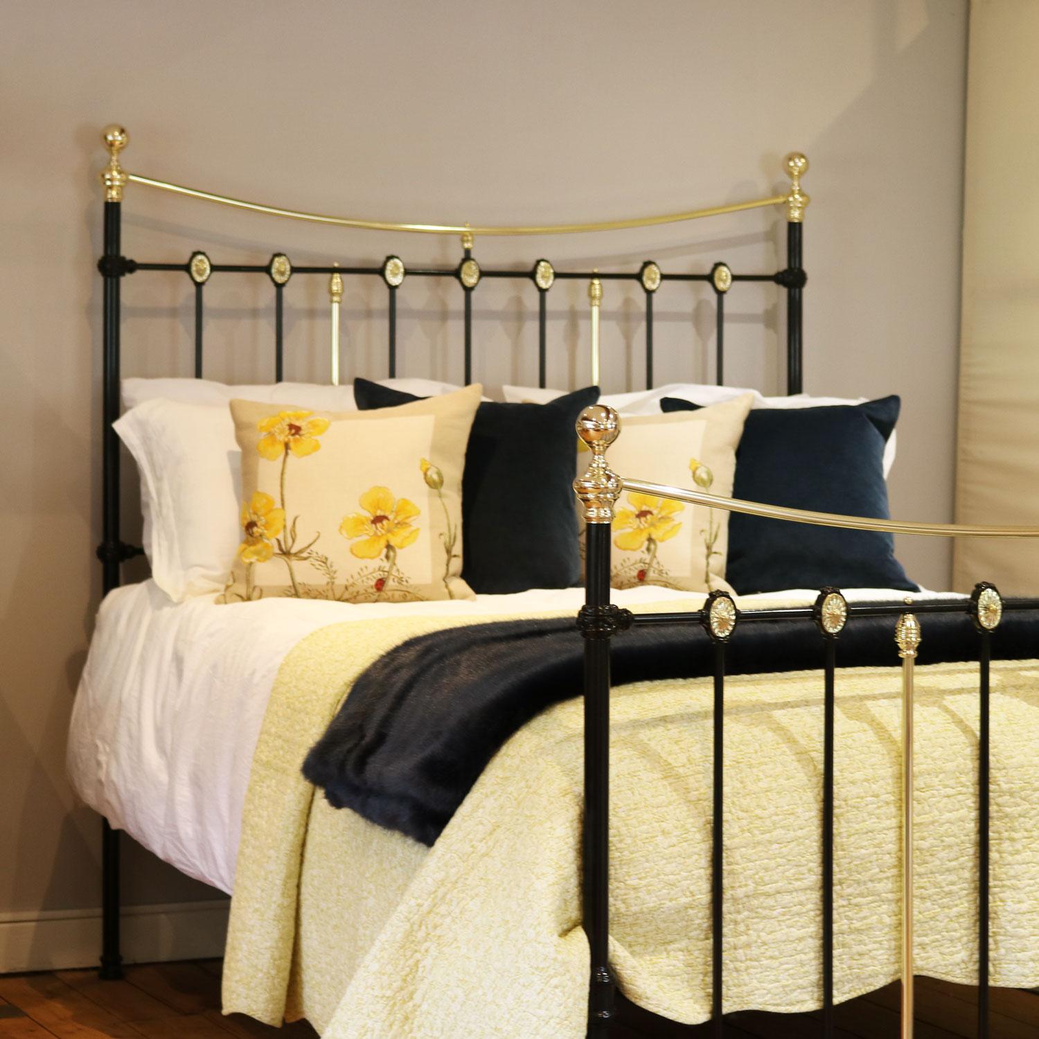 A decorative traditional brass and iron bedstead finished in black with decorative brass castings and curved brass top rails. 

This bed accepts a UK king size or US queen size (5ft, 60in or 150cm wide) base and mattress set.

The price includes