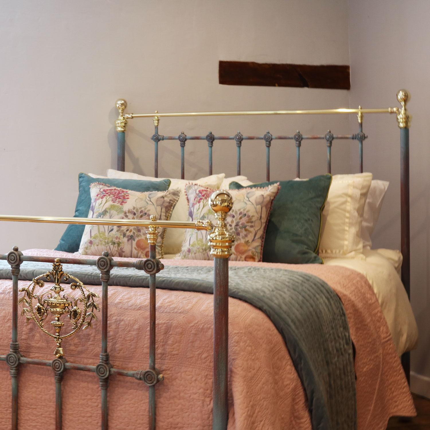 An ornate brass and iron bedstead finished in blue verdigris with large decorative brass castings in the foot panel. 

This bed accepts a UK king size or US queen size (5ft, 60in or 150cm wide) base and mattress set.

The price includes a