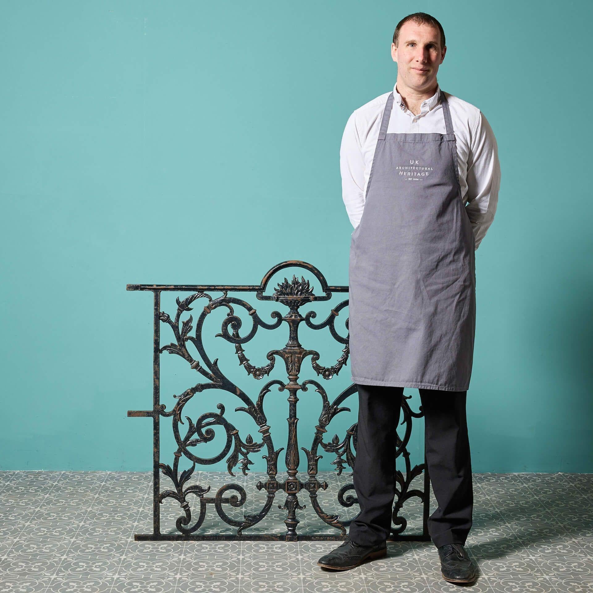 A decorative antique English cast iron railing panel by George Wright & Co, Rotherham (stamped). This is one of various similar pieces we have available for sale, each usable as individual decorative panels or together as a balcony or garden
