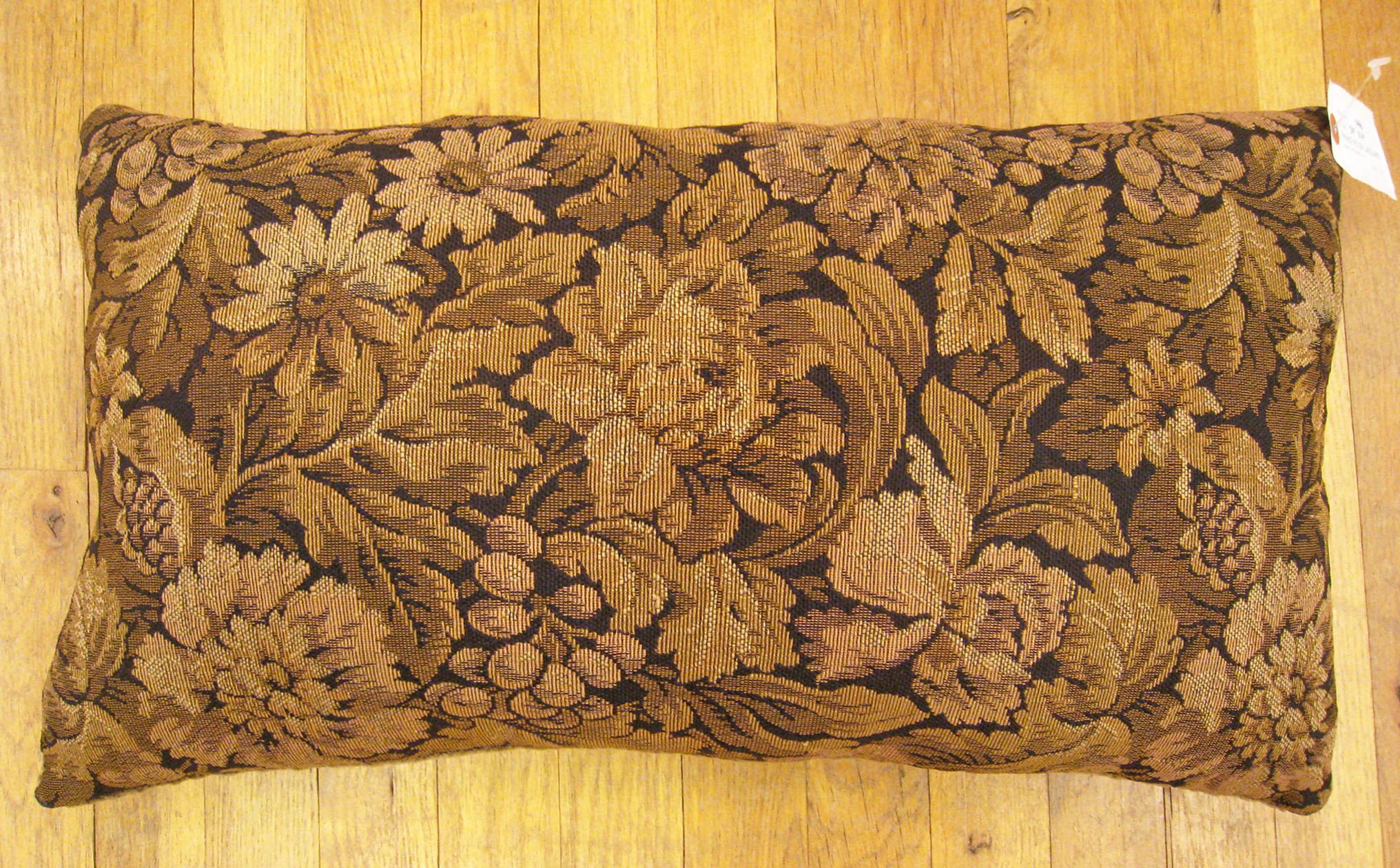 Antique French tapestry pillow; size 24” x 14” (2’ 0” x 1’ 2”). 

An antique decorative pillow with floral elments allover a brown central field, size 24” x 14” (2’ 0” x 1’ 2”). This lovely decorative pillow features an antique fabric on front