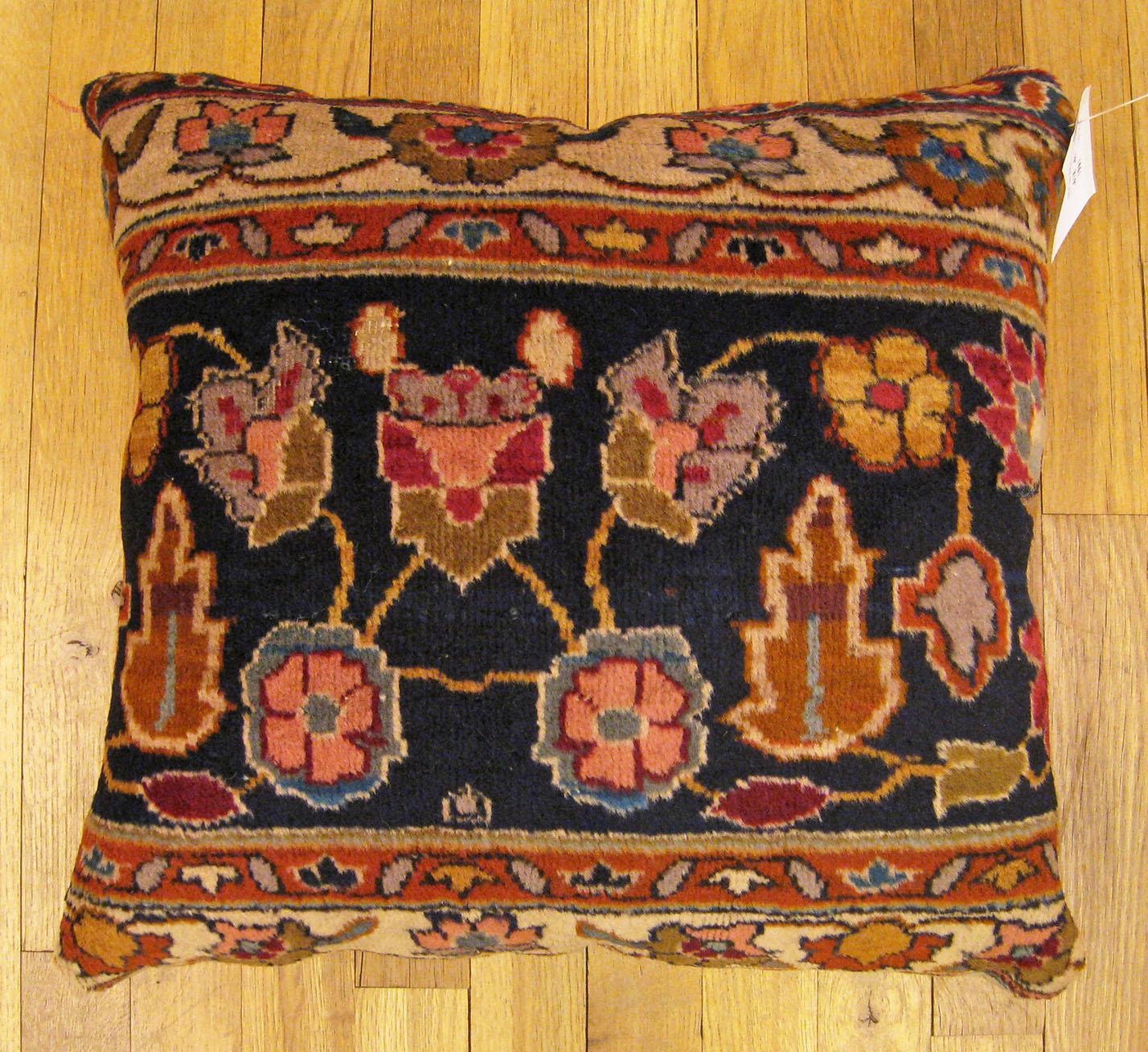 Antique Indian Agra rug pillow; size 1'5” x 1'5”.

An antique decorative pillow with floral elements allover a blue central field, size 1'5” x 1'5”. This lovely decorative pillow features an antique fabric of a Agra rug on front which is