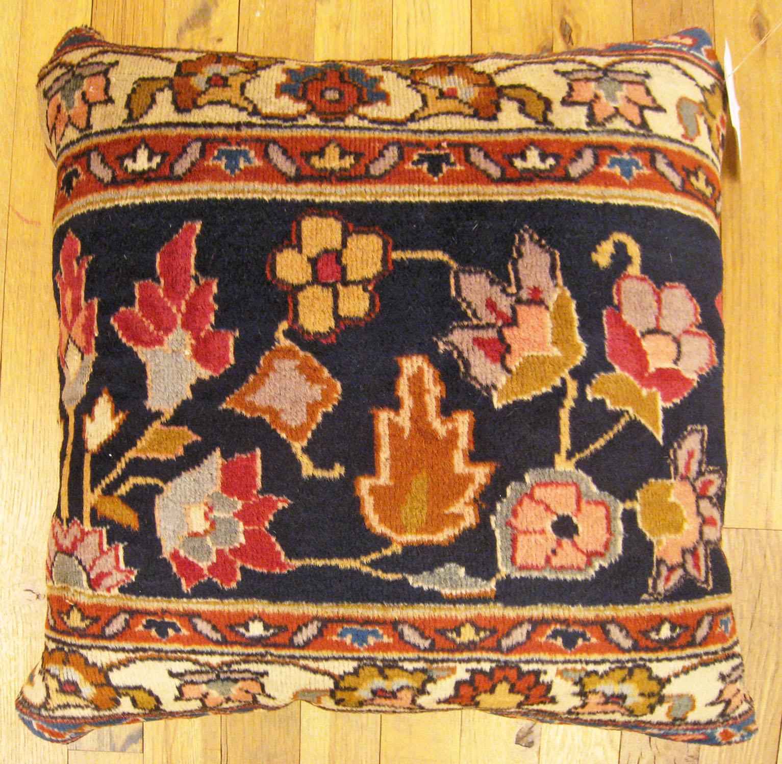 Antique Indian Agra Rug Pillow; size 1'6” x 1'6”.

An antique decorative pillow with floral elements allover a blue central field, size 1'6” x 1'6”. This lovely decorative pillow features an antique fabric of a Agra rug on front which is