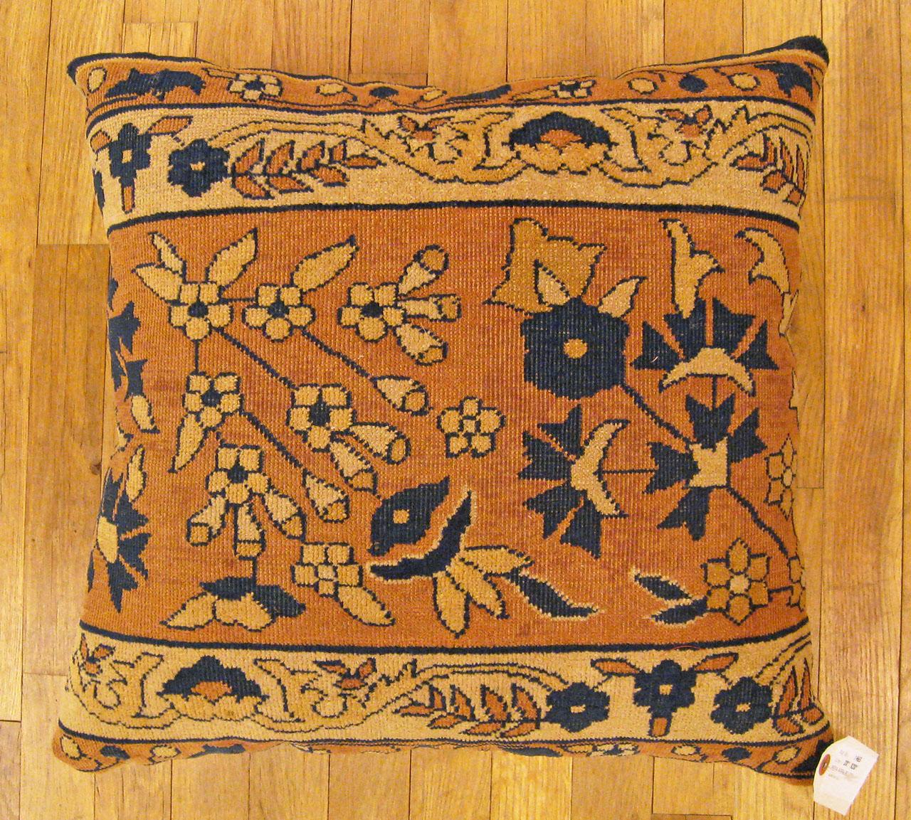 Antique Indian Agra rug pillow; size 1'8” x 1'8”.

An antique decorative pillow with floral elements allover a salmon central field, size 1'8” x 1'8”. This lovely decorative pillow features an antique fabric of a Agra rug on front which is