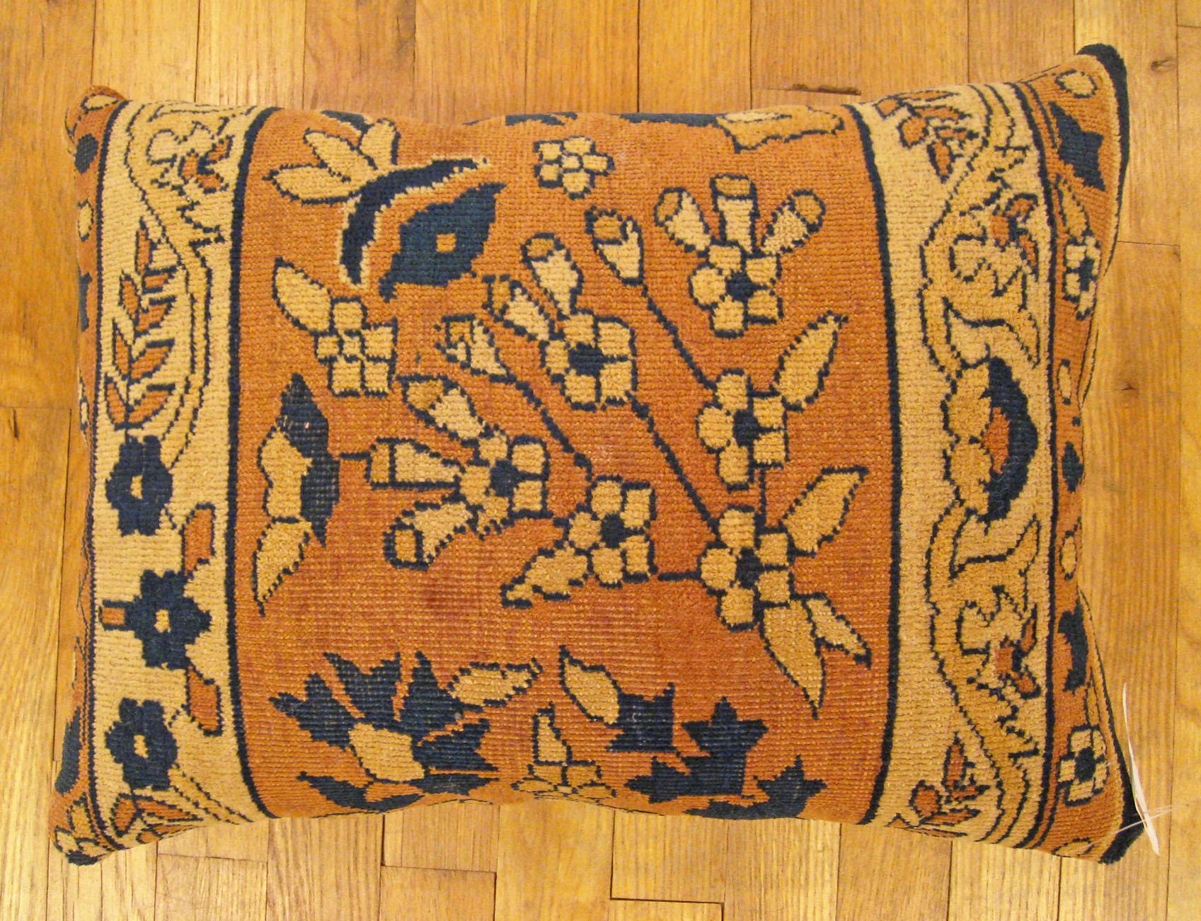 Antique Indian Agra rug pillow; size 20” x 15” (1’ 8” x 1’ 3”).

An antique decorative pillow with floral elements allover a salmon central field, size 20” x 15” (1’ 8” x 1’ 3”). This lovely decorative pillow features an antique fabric of a Agra