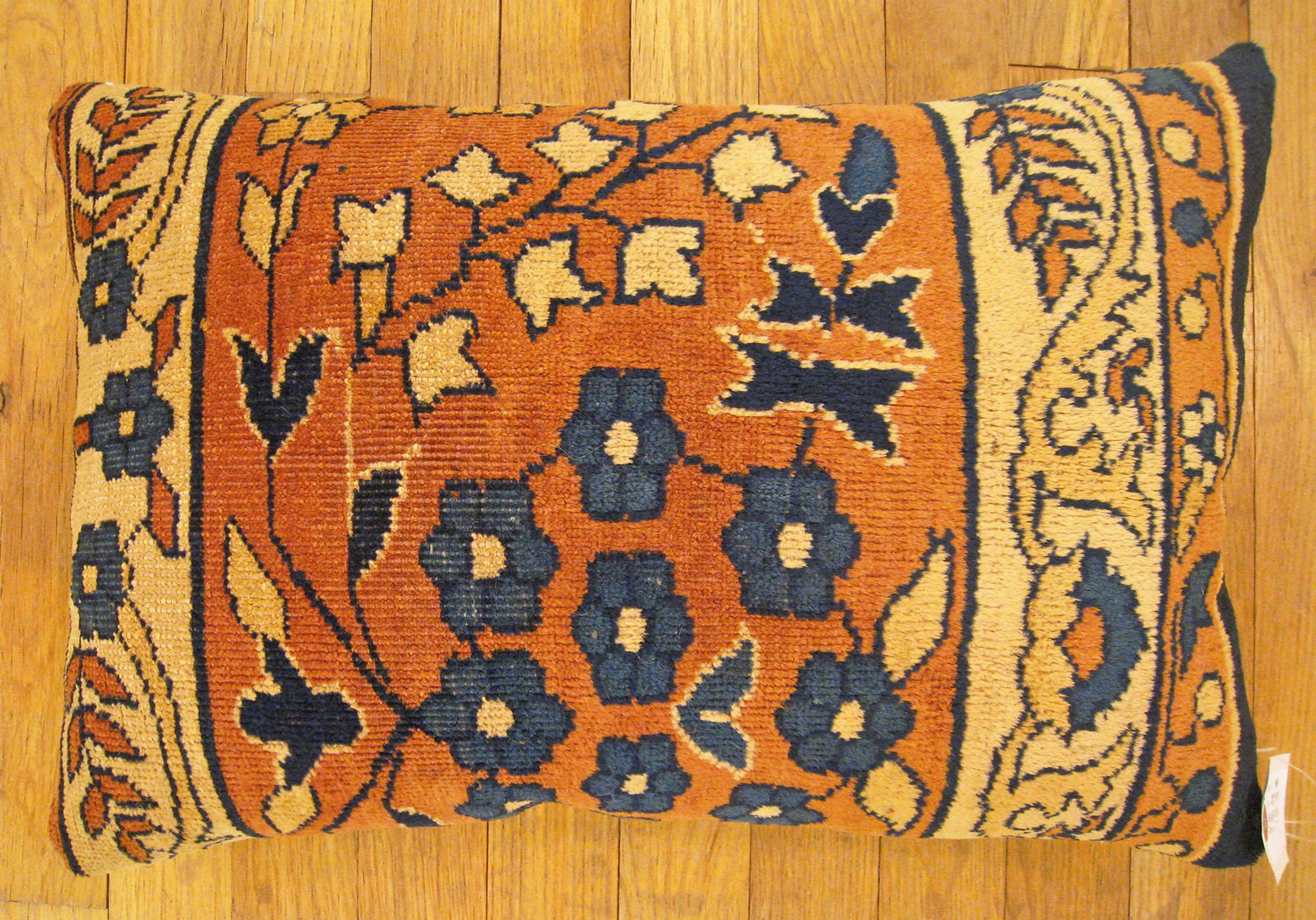 Antique Indian Agra rug pillow; size 1'8” x 1'2”.

An antique decorative pillow with floral elements allover a salmon central field, size 1'8” x 1'2”. This lovely decorative pillow features an antique fabric of a Agra rug on front which is