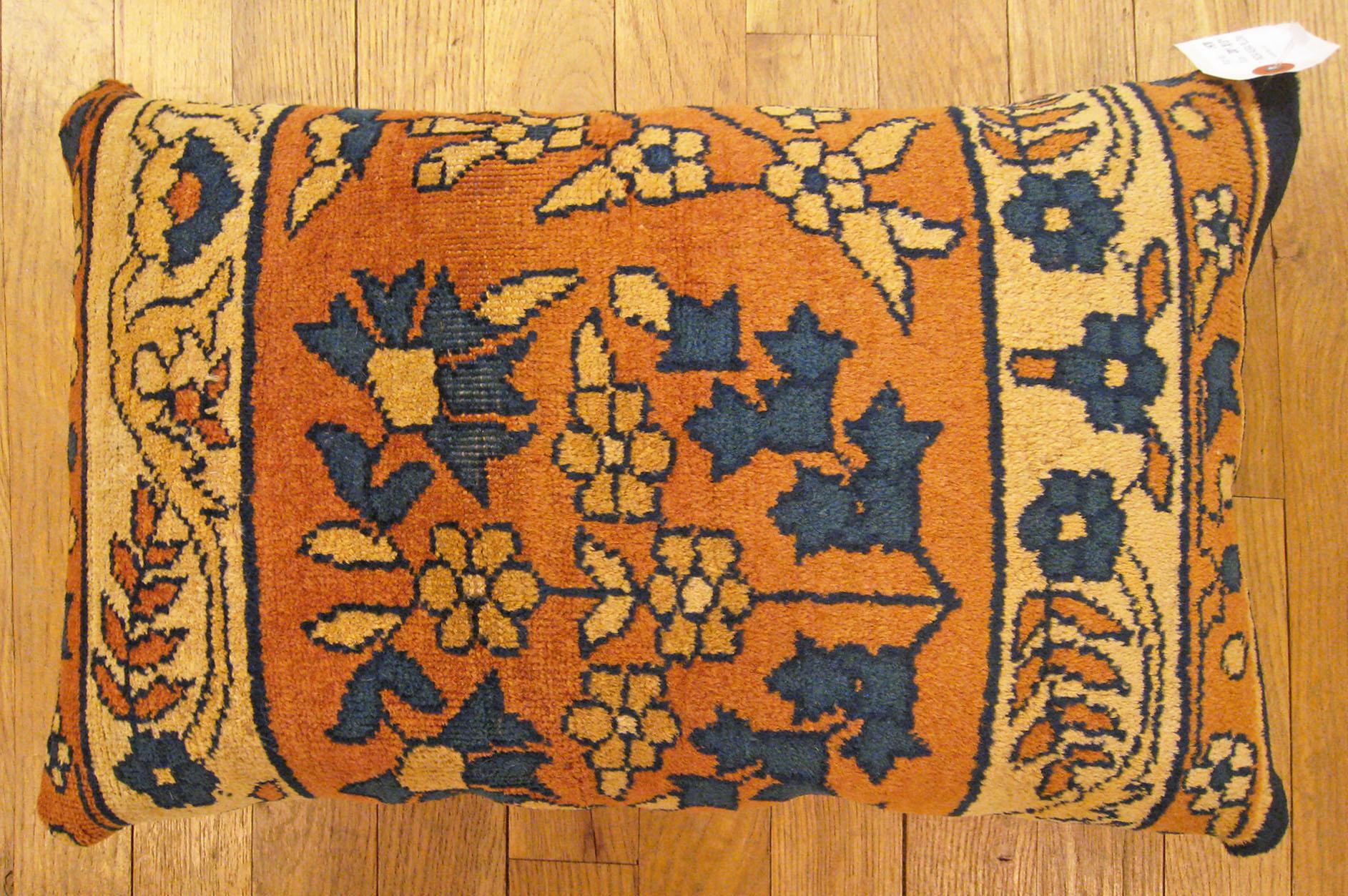Antique Indian Agra Rug Pillow; size 1'8” x 1'1”.

An antique decorative pillow with floral elements allover a salmon central field, size 1'8” x 1'1”. This lovely decorative pillow features an antique fabric of a Agra rug on front which is