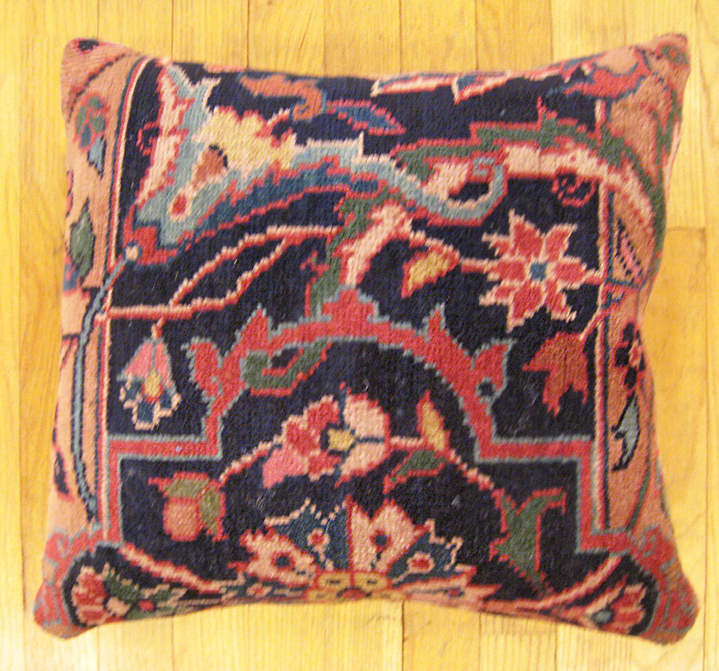 Antique Indian Agra rug pillow; size 1'6” x 1'4”.

An antique decorative pillow with floral elements allover a coral central field, size 1'6” x 1'4”. This lovely decorative pillow features an antique fabric of a Agra rug on front which is