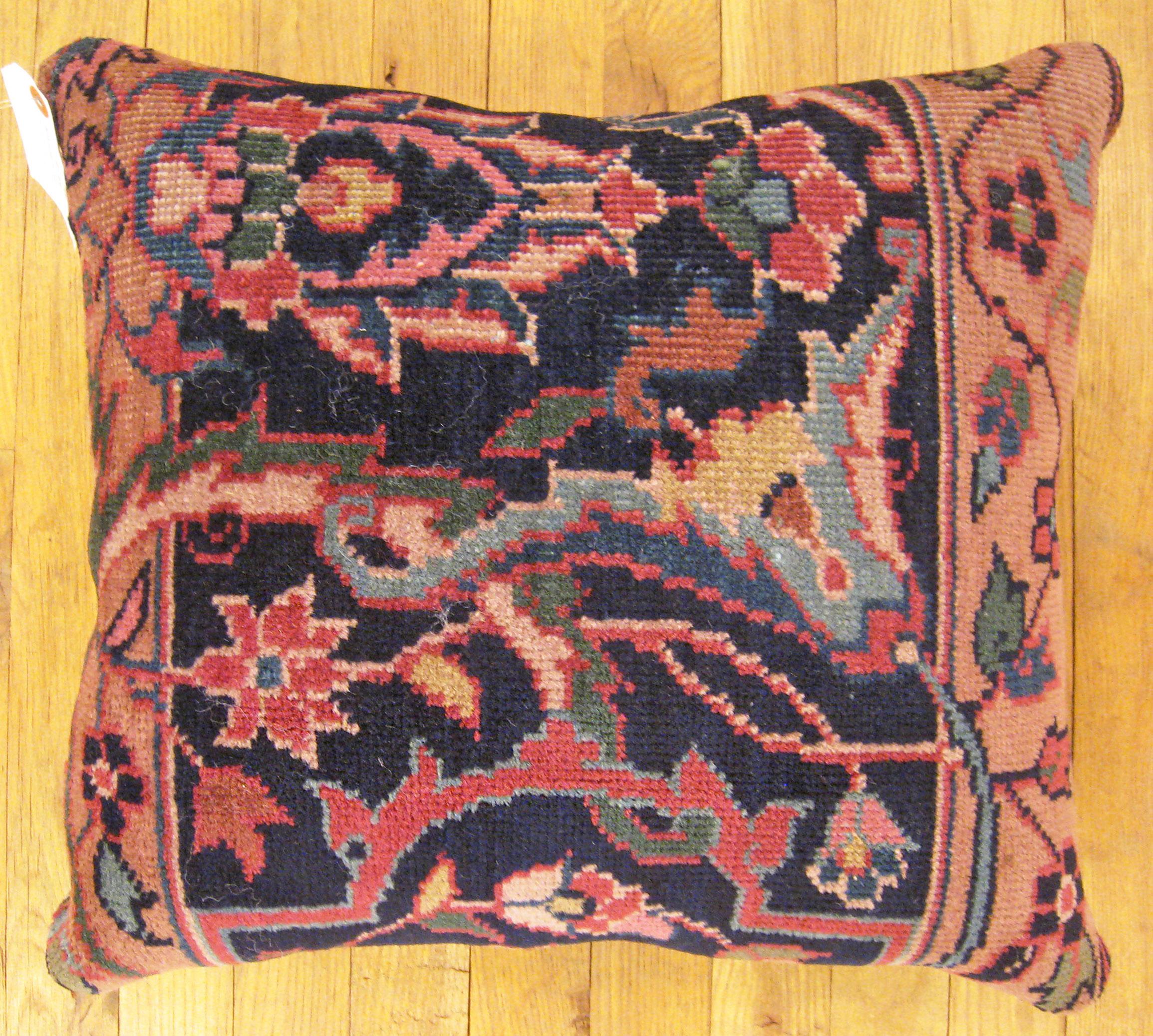 Antique Indian Agra rug pillow; size 1'6” x 1'4”.

An antique decorative pillow with floral elements allover a coral central field, size 1'6” x 1'4”. This lovely decorative pillow features an antique fabric of a Agra rug on front which is