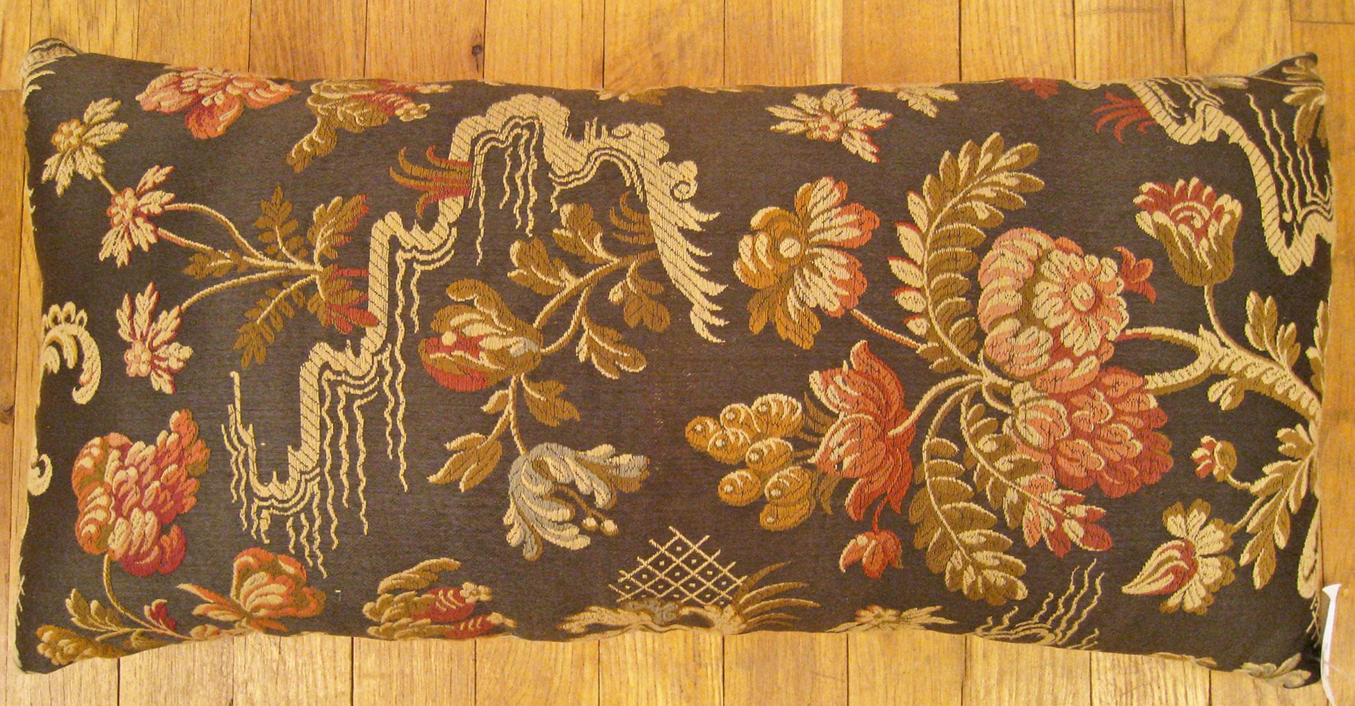 Antique Jacquard Tapestry pillow; size 1'0” x 2'0”.

An antique decorative pillow with a garden design allover a light brown central field, size 1'0