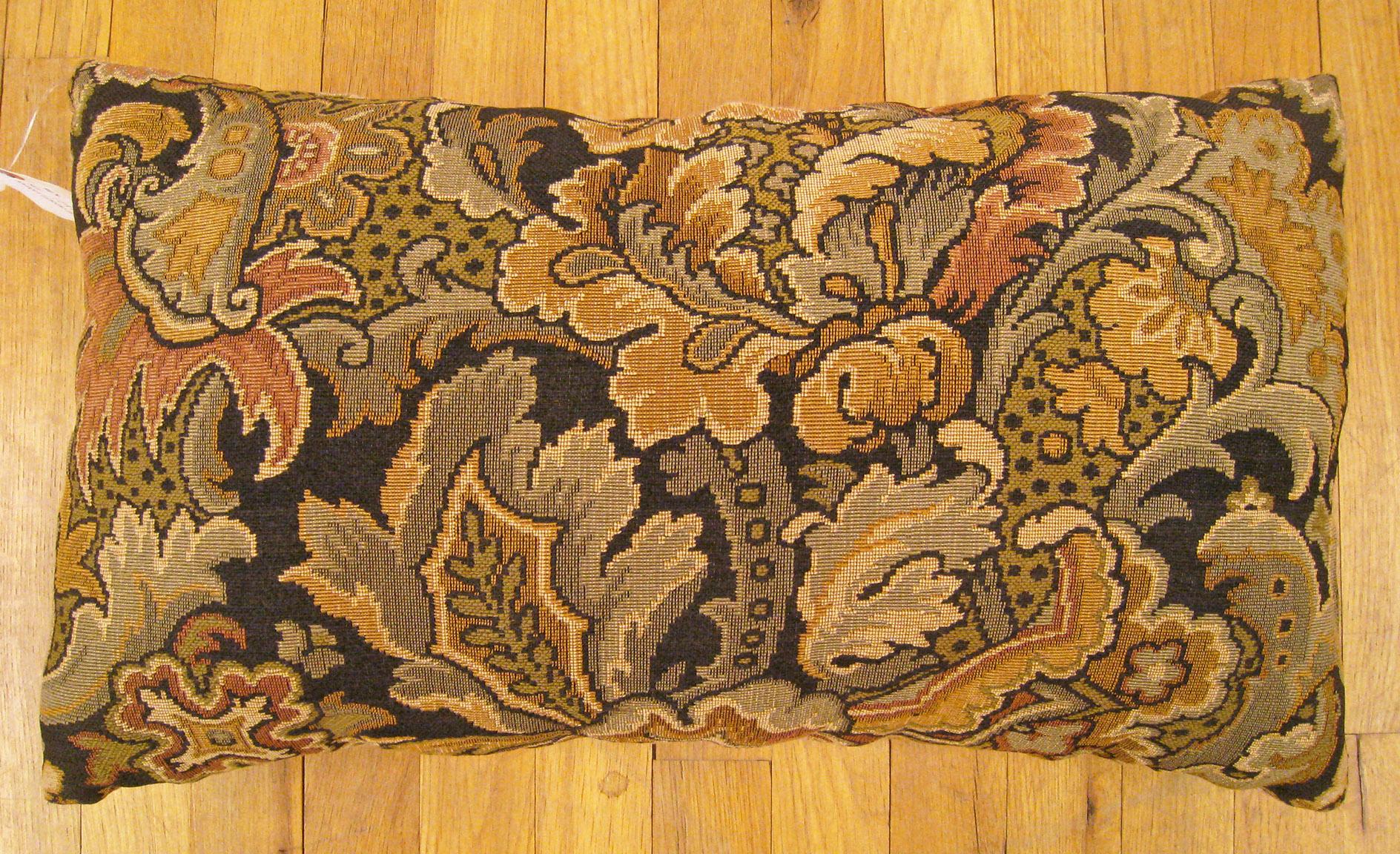 Antique Jacquard Tapestry Pillow; size 1'2” x 2'0”.

An antique decorative pillow with floral elements allover a gold green central field, size 1'2