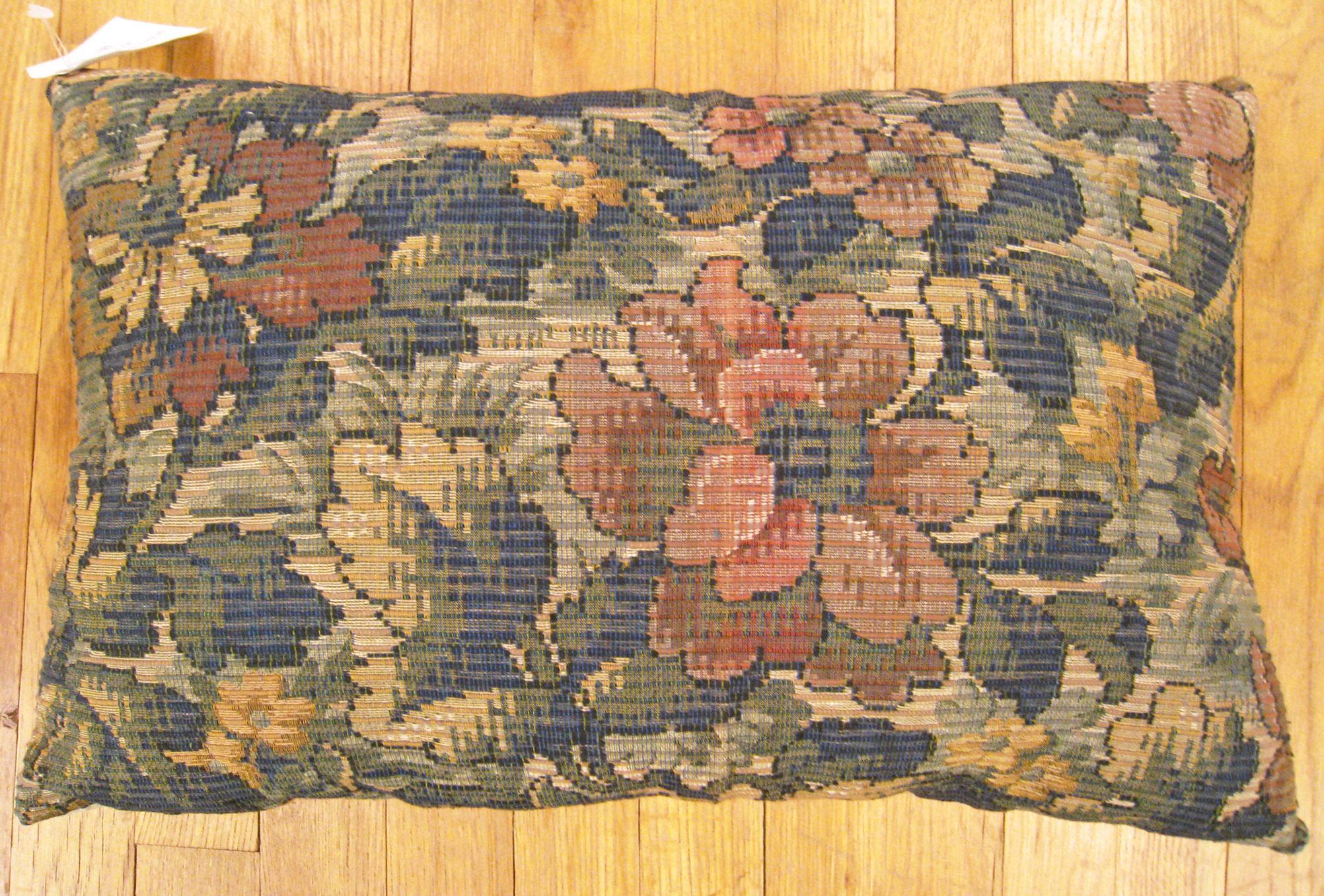 Antique Jacquard Tapestry pillow; size 1'2” x 1'8”.

An antique decorative pillow with floral elements allover a dusty rose central field, size 1'2