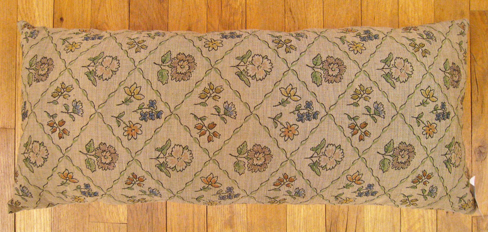 Antique Jacquard Tapestry Pillow; size 1'0” x 2'2”.

An antique decorative pillow with floral elements allover a blue green central field, size 1'0