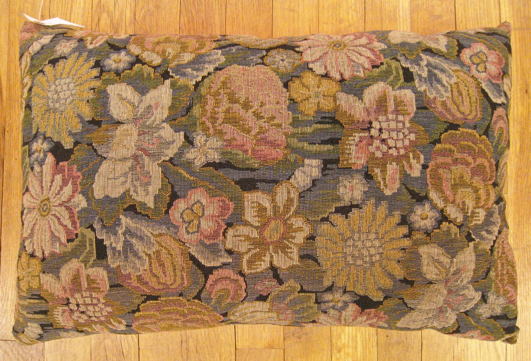 Antique Jacquard Tapestry Pillow; size 1'4” x 2'0”.

An antique decorative pillow with floral elements allover a gold gray central field, size 1'4