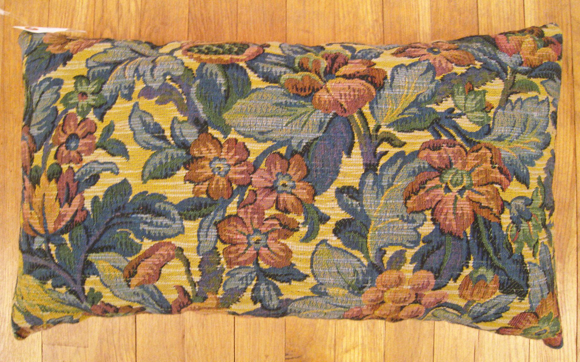 Antique Jacquard Tapestry Pillow; size 1'2” x 2'0”.

An antique decorative pillow with floral elements and birds allover a blue green central field, size 1'2