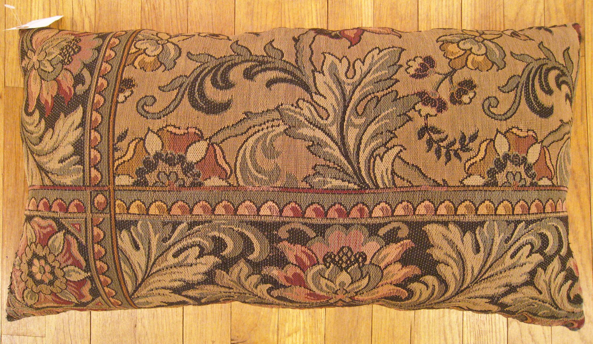 Antique Jacquard Tapestry Pillow; size 1'3” x 2'2”.

An antique decorative pillow with floral elements allover a brown central field, size 1'3