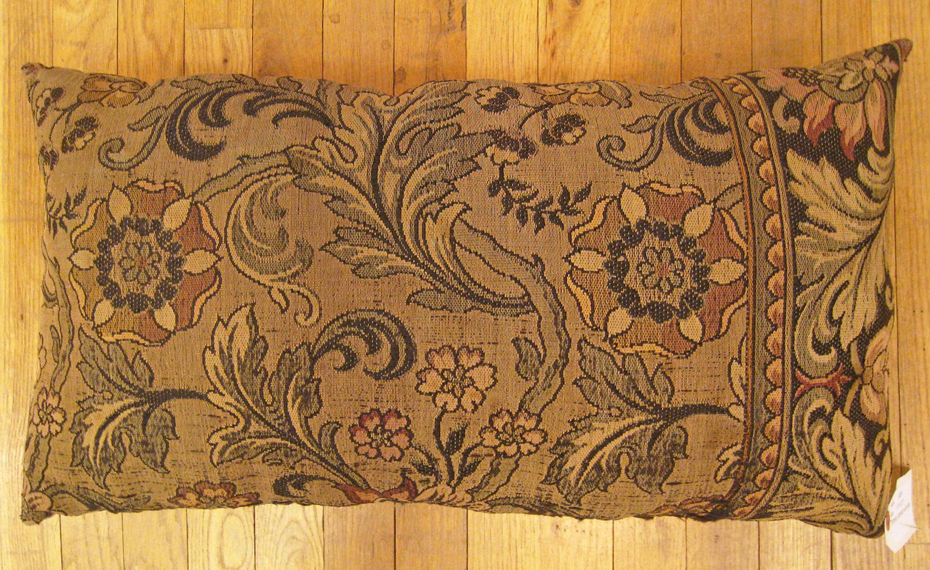 Antique Jacquard Tapestry Pillow; size 1'3” x 2'2”.

An antique decorative pillow with floral elements allover a brown central field, size 1'3
