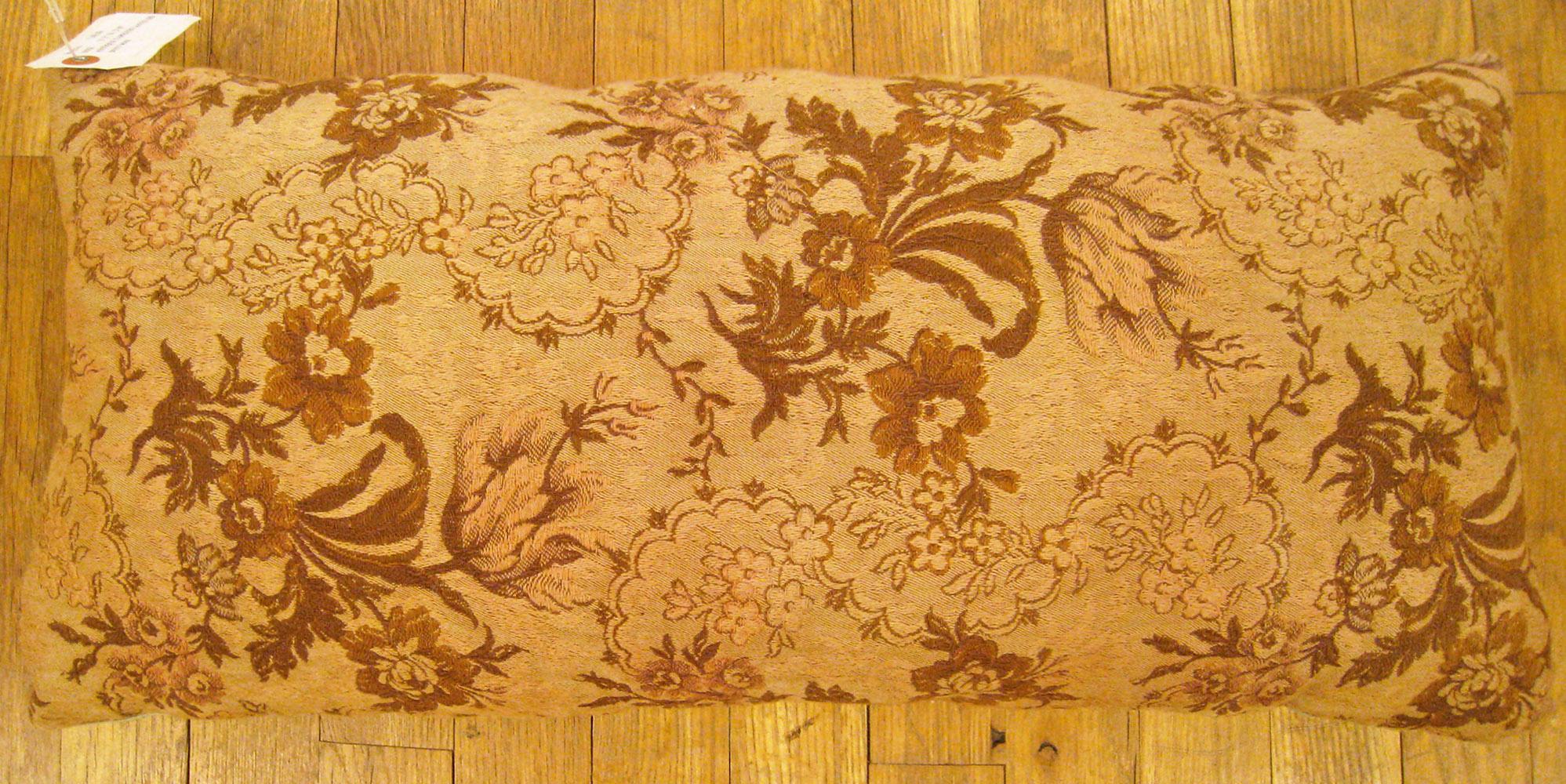 Antique Jacquard Tapestry Pillow; size 1'1” x 2'0”. 

An antique decorative pillow with floral elements allover a light brown central field, size 1'1