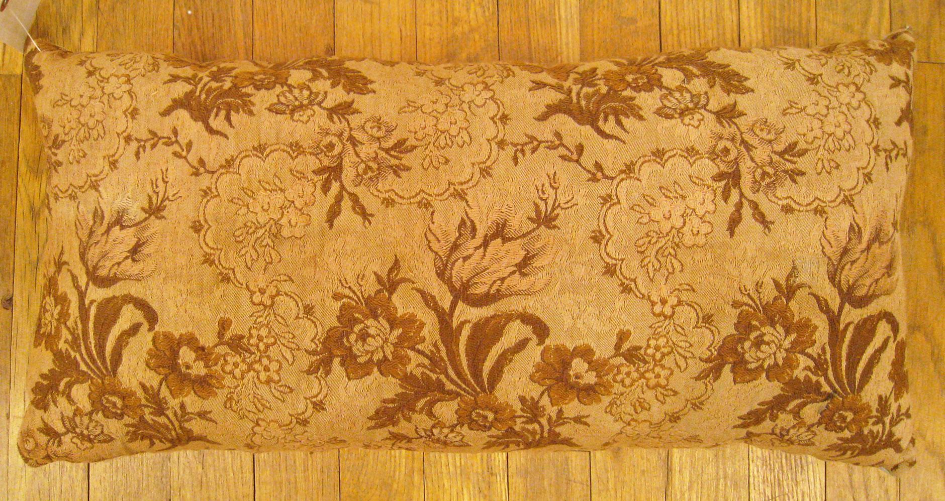 Antique Jacquard Tapestry Pillow; size 1'1” x 2'0”. 

An antique decorative pillow with floral elements allover a light brown central field, size 1'1