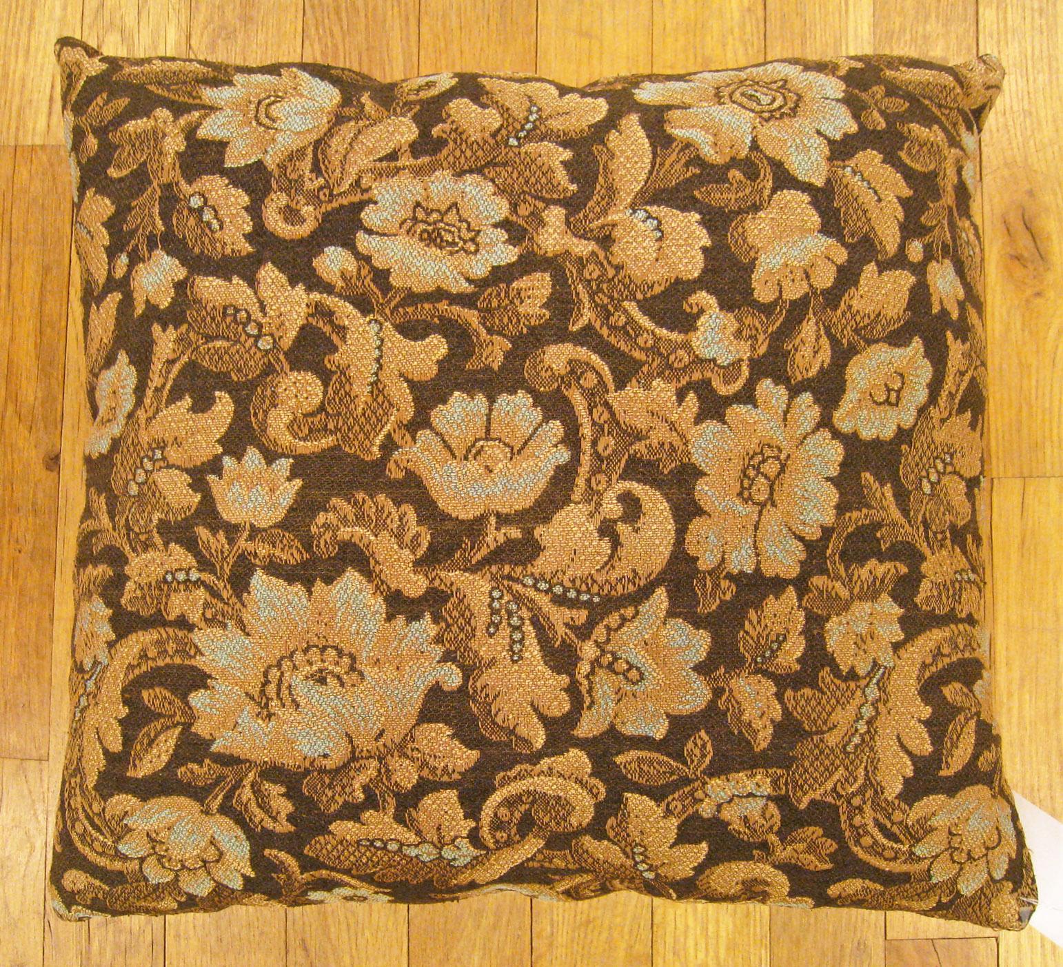 Antique Jacquard Tapestry pillow; size 1'5” x 1'5”.

An antique decorative pillow with floral elements allover a light gold central field, size 1'5