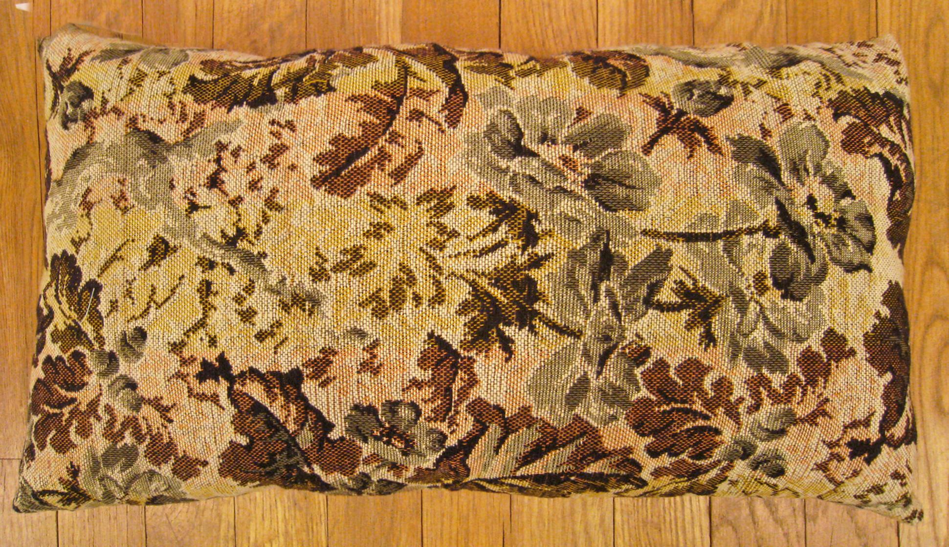 Antique Jacquard Tapestry pillow; size 1'0” x 1'8”. 

An antique decorative pillow with floral elements allover a light shrimp central field, size 1'0