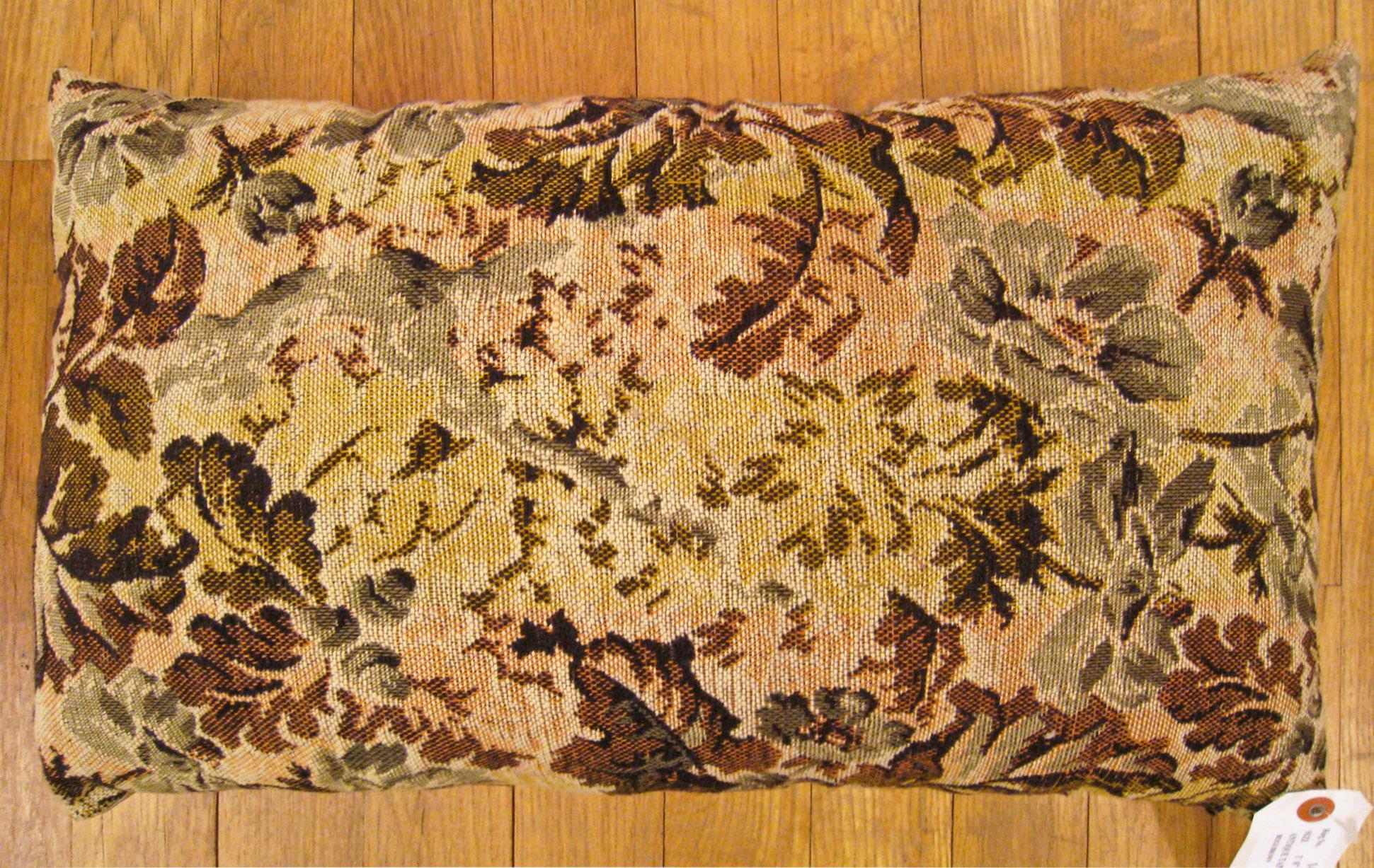 Antique Jacquard Tapestry Pillow; size 1'0” x 1'8”. 

An antique decorative pillow with floral elements allover a light shrimp central field, size 1'0