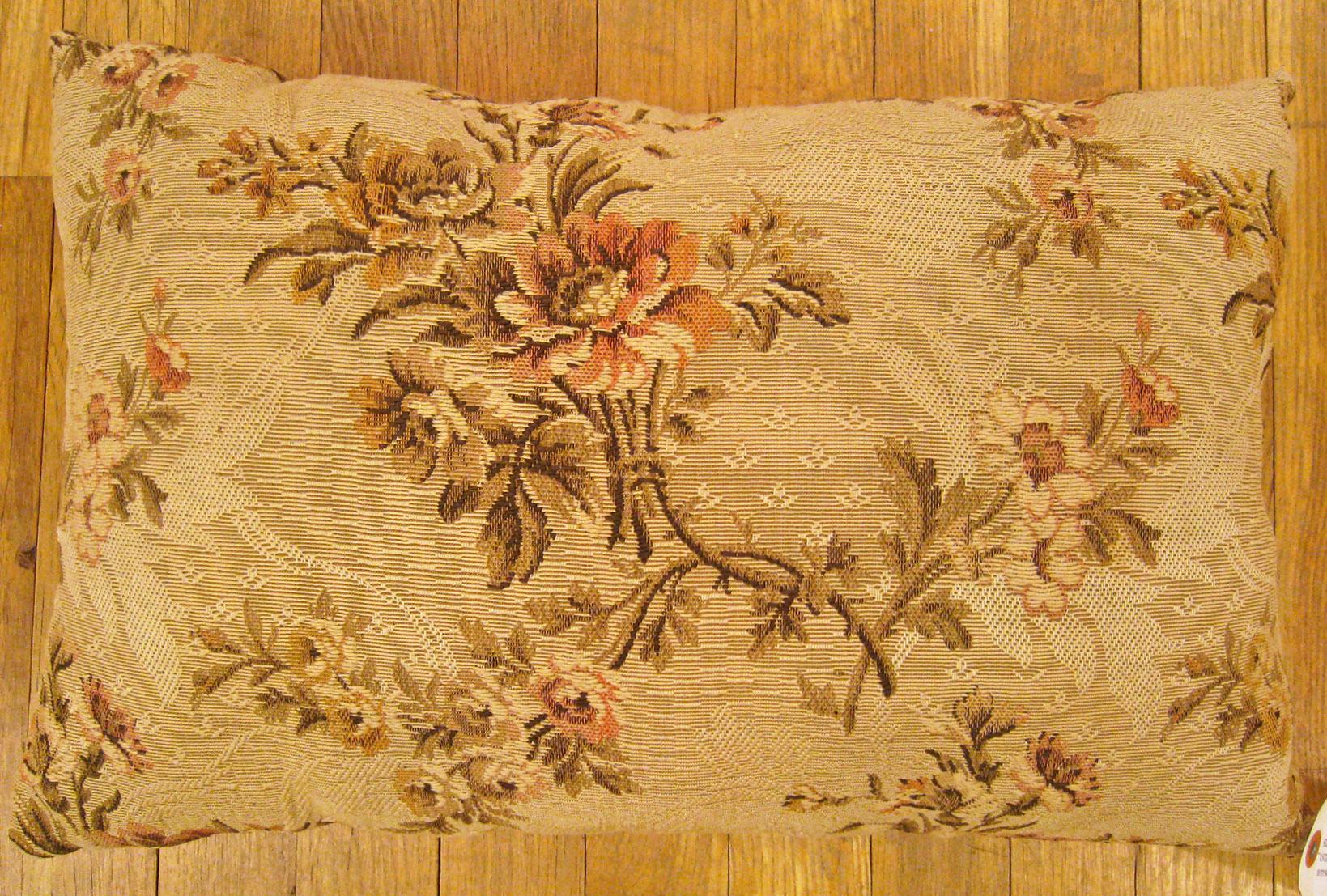 Antique Jacquard Tapestry Pillow; size 1'2” x 1'9”.

An antique decorative pillow with floral elements allover a dusty rose central field, size 1'2