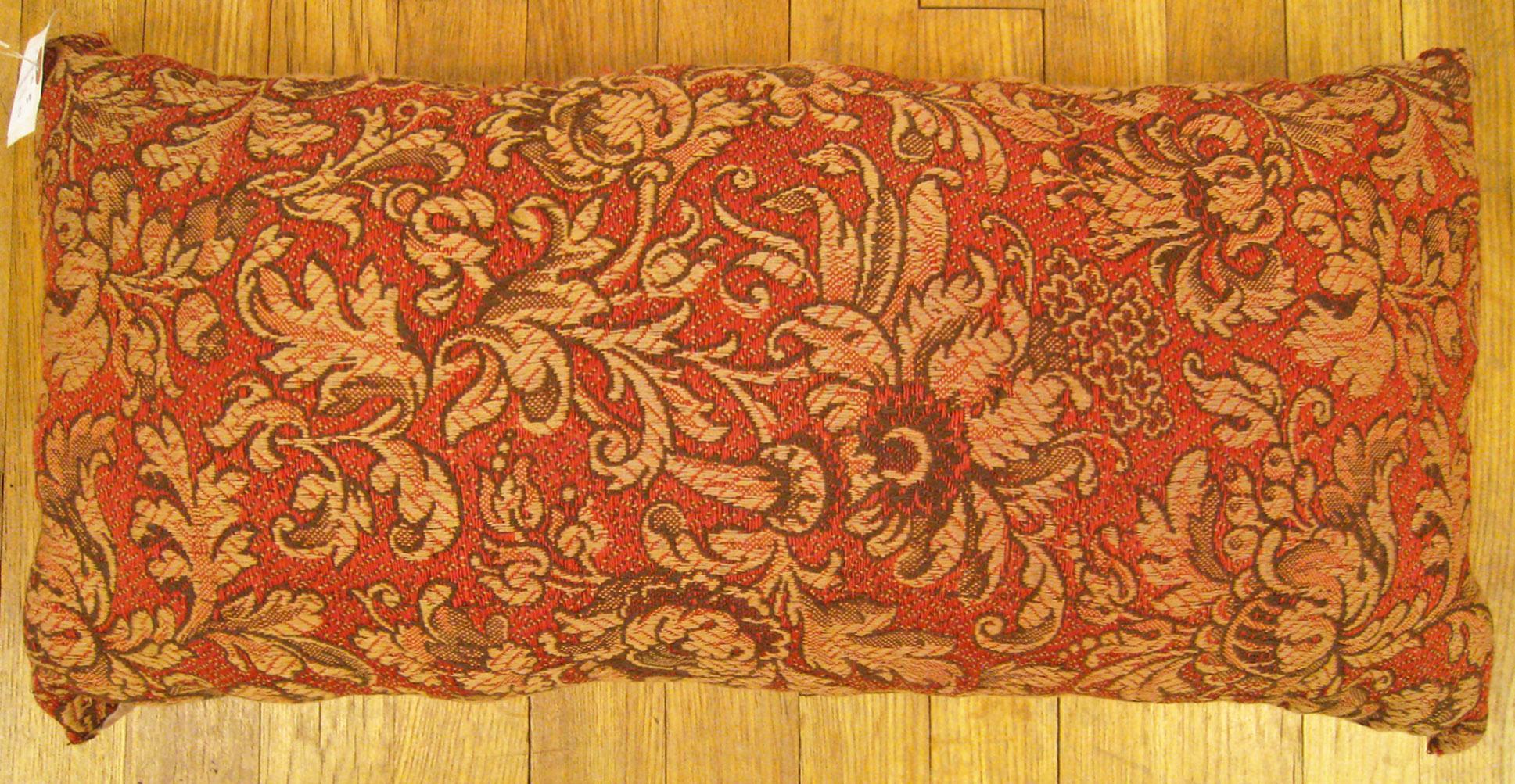 Antique Jacquard Tapestry Pillow; size 1'0” x 2'0”. 

An antique decorative pillow with floral elements allover a soft red central field, size 1'0