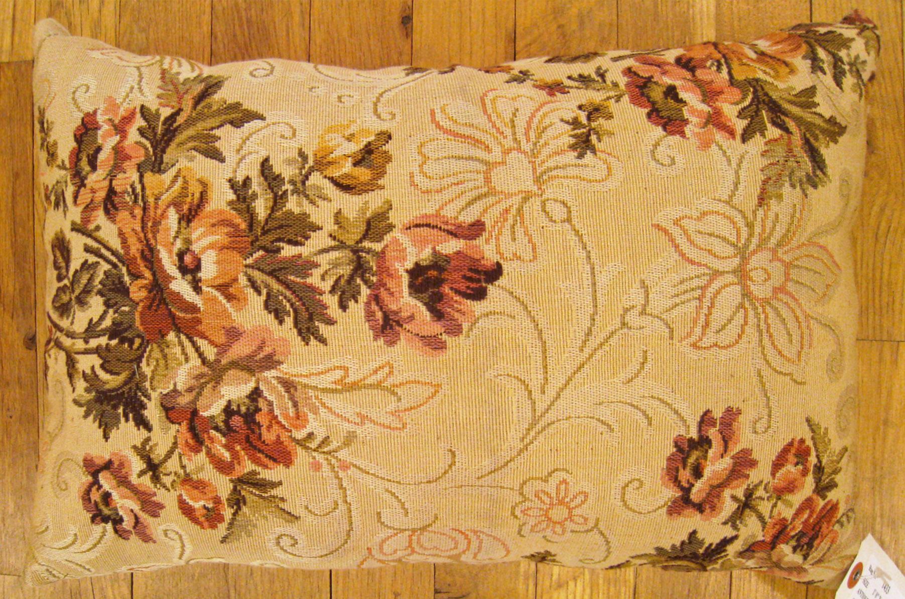 Antique Jacquard Tapestry Pillow; size 1'0” x 1'7”. 

An antique decorative pillow with floral elements allover a light gold central field, size 1'0