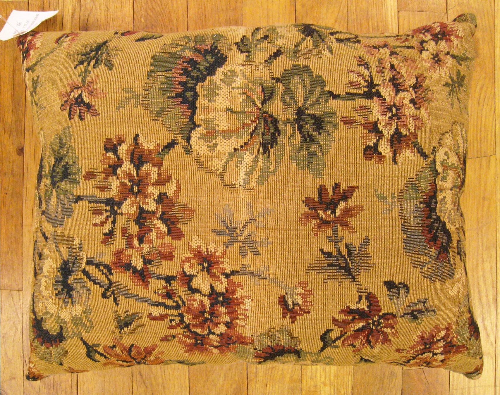 Antique Jacquard Tapestry pillow; size 1'3” x 1'6”.

An antique decorative pillow with floral elments allover a light gold central field, size 1'3
