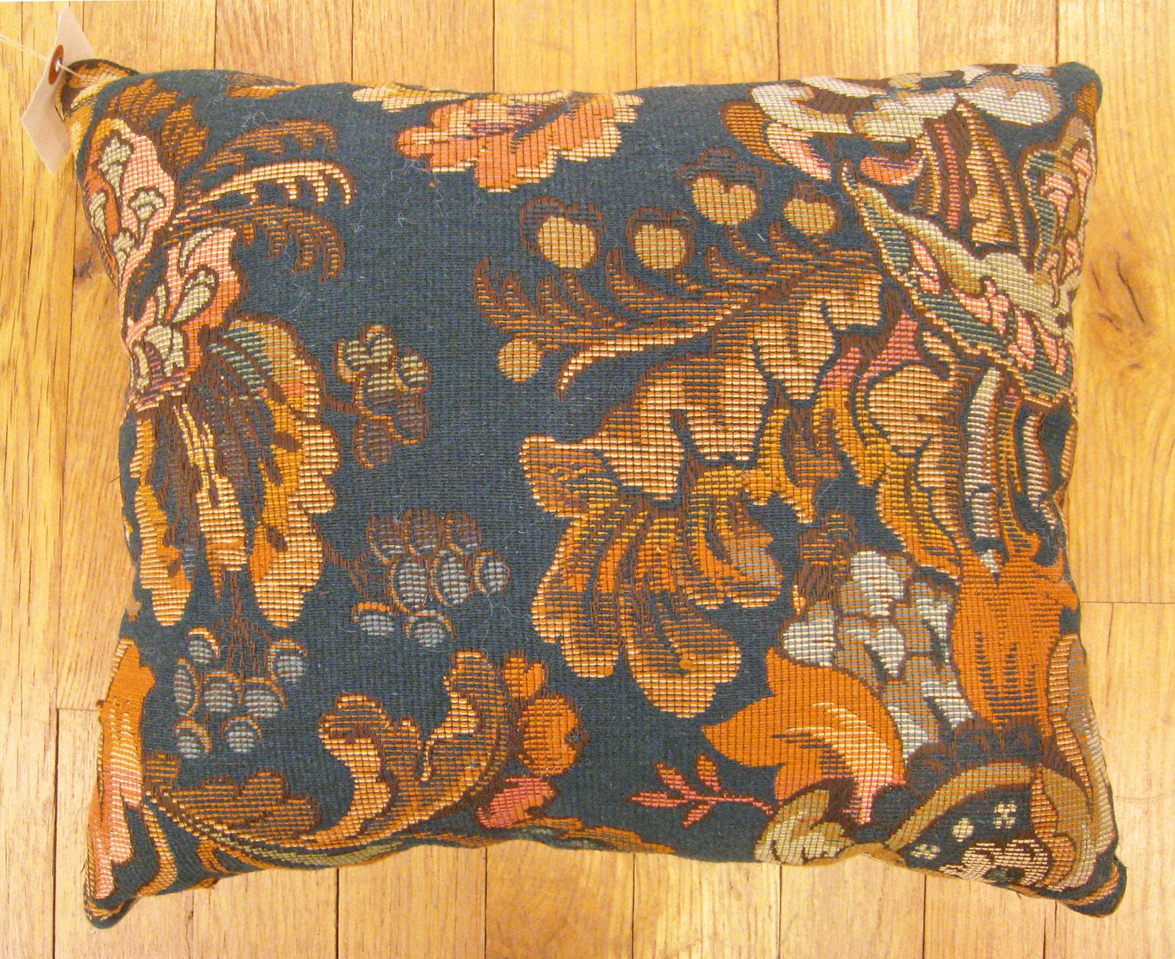 Antique Jacquard Tapestry Pillow; size 1'1” x 1'3”. 

An antique decorative pillow with floral elements allover an overdye blue central field, size 1'1