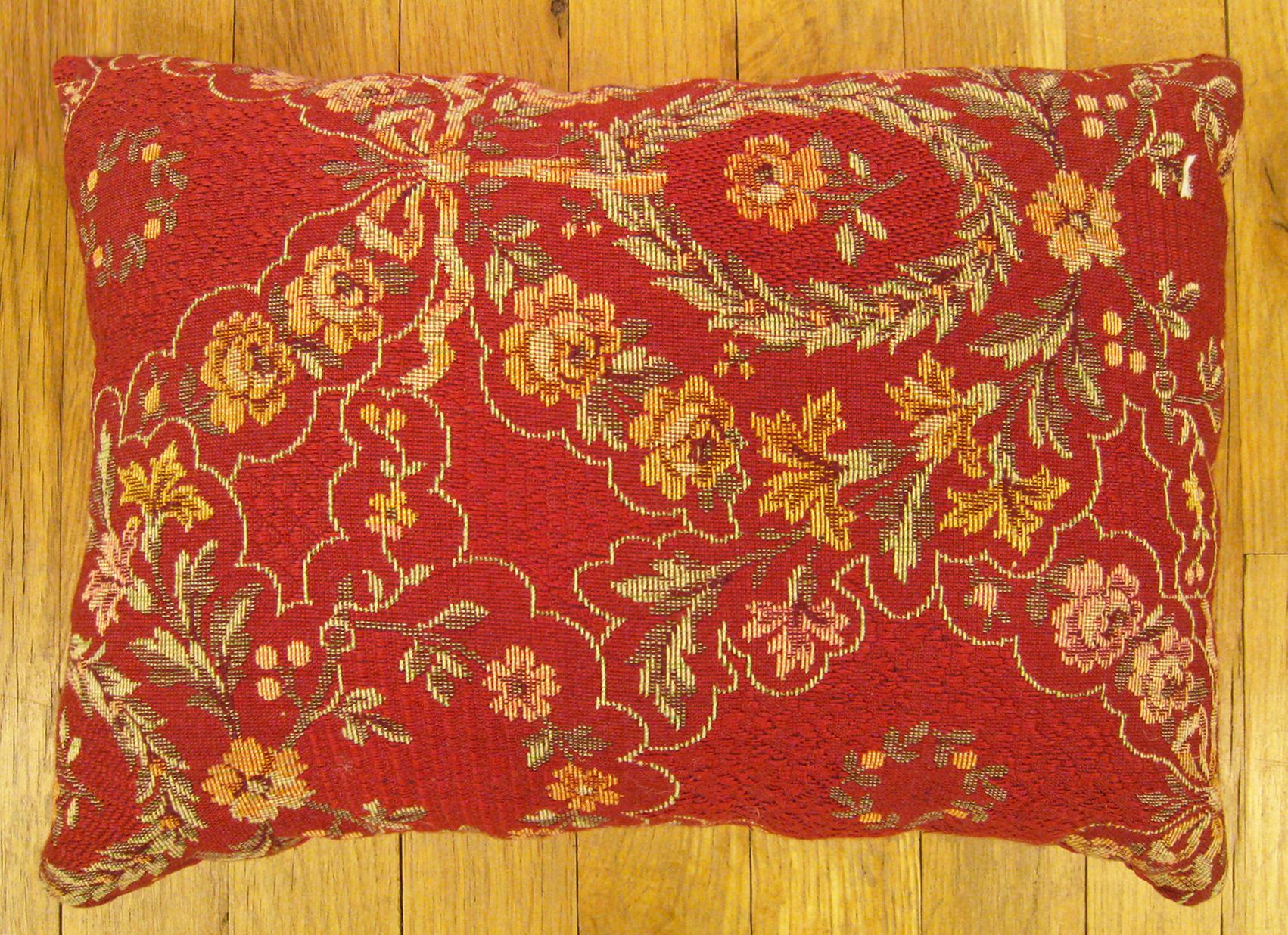 Antique Jacquard Tapestry Pillow; size 1'0” x 1'3”.

An antique decorative pillow with floral elements allover a red central field, size 1'0